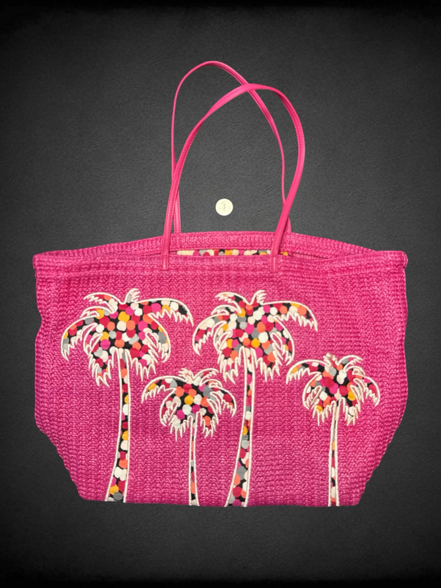 Vera Bradley pink woven beach bag with palm tree design on front