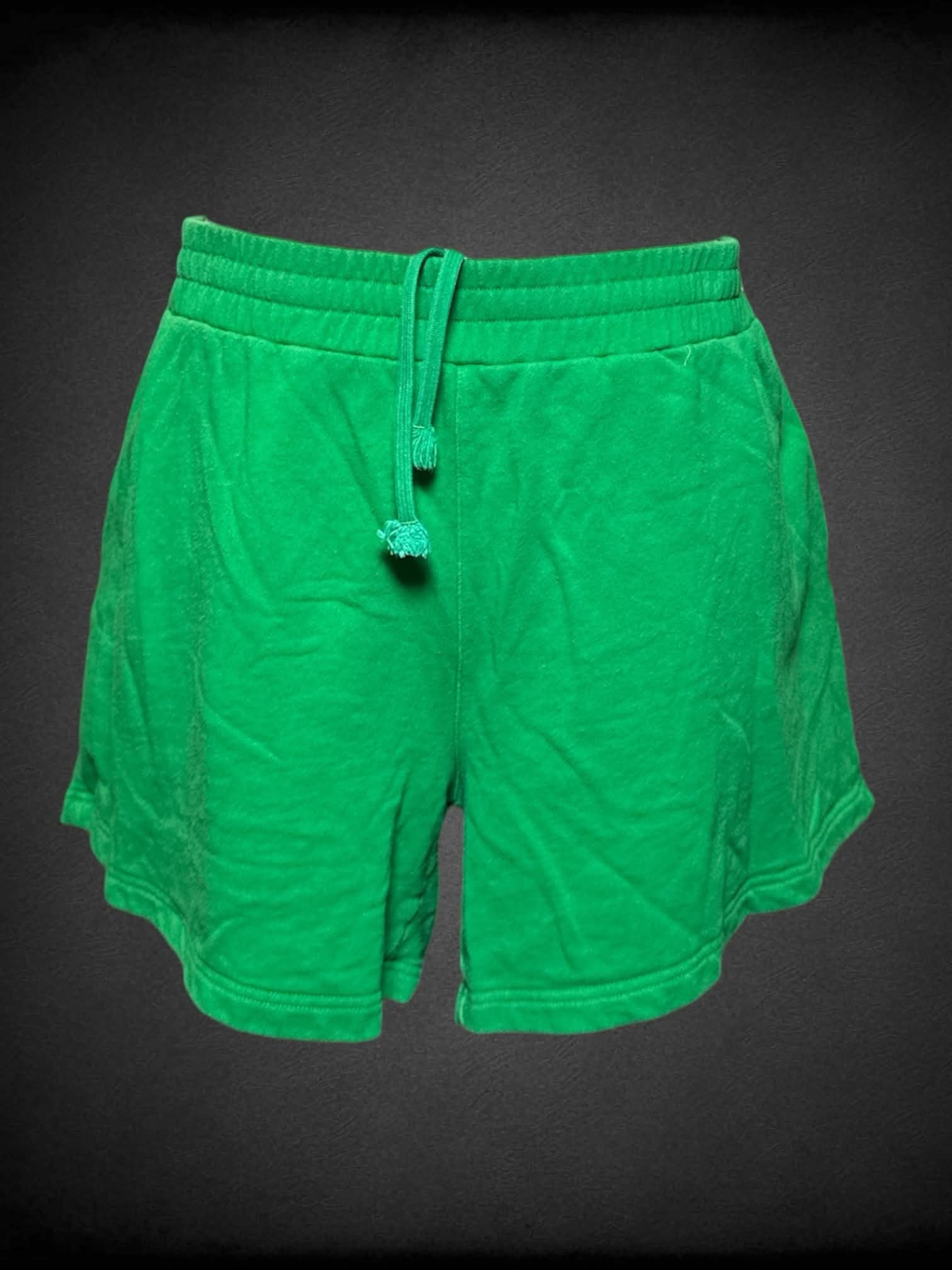 3X Shiny By Nature green shorts with embroidered “Shiny By Nature” writing on front pocket, and adjustable stretch waist