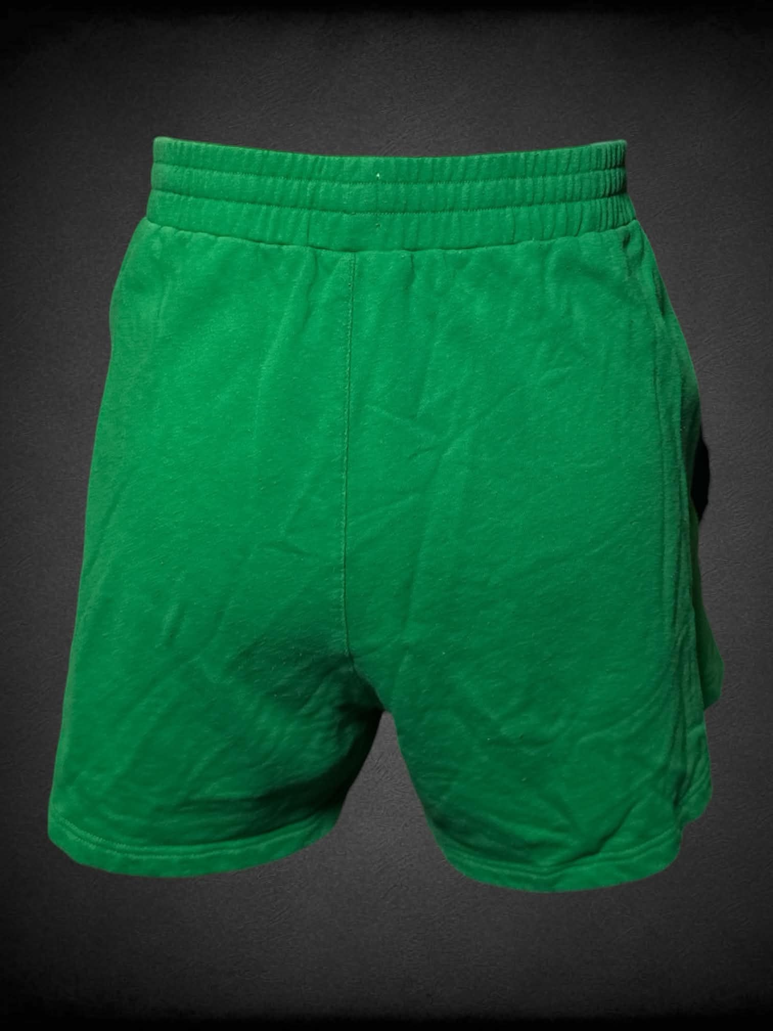 3X Shiny By Nature green shorts with embroidered “Shiny By Nature” writing on front pocket, and adjustable stretch waist