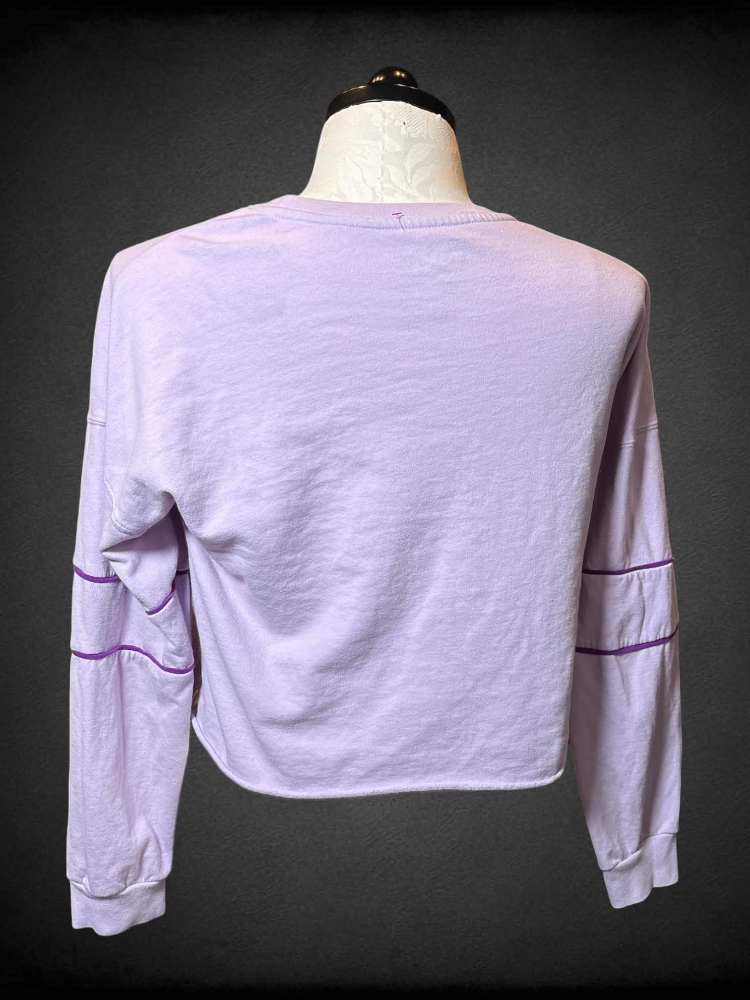 0X MTV pastel purple long-sleeve shirt with “MTV” graphic on front, and “MTV” logo on sleeve