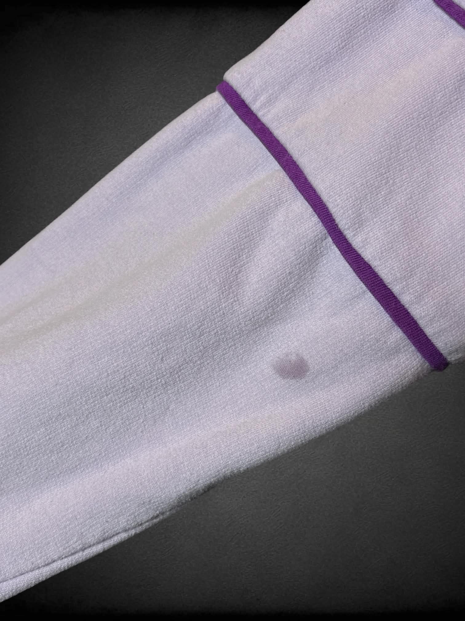0X MTV pastel purple long-sleeve shirt with “MTV” graphic on front, and “MTV” logo on sleeve