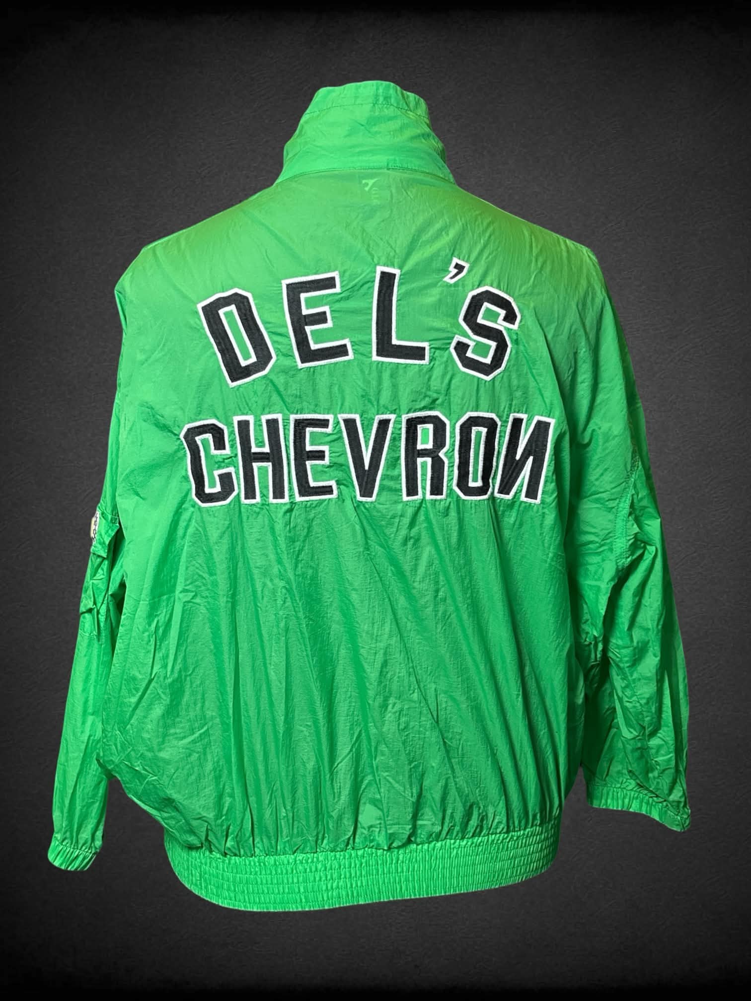 2X Glory 21 green windbreaker with “Del’s Chevron” writing on back