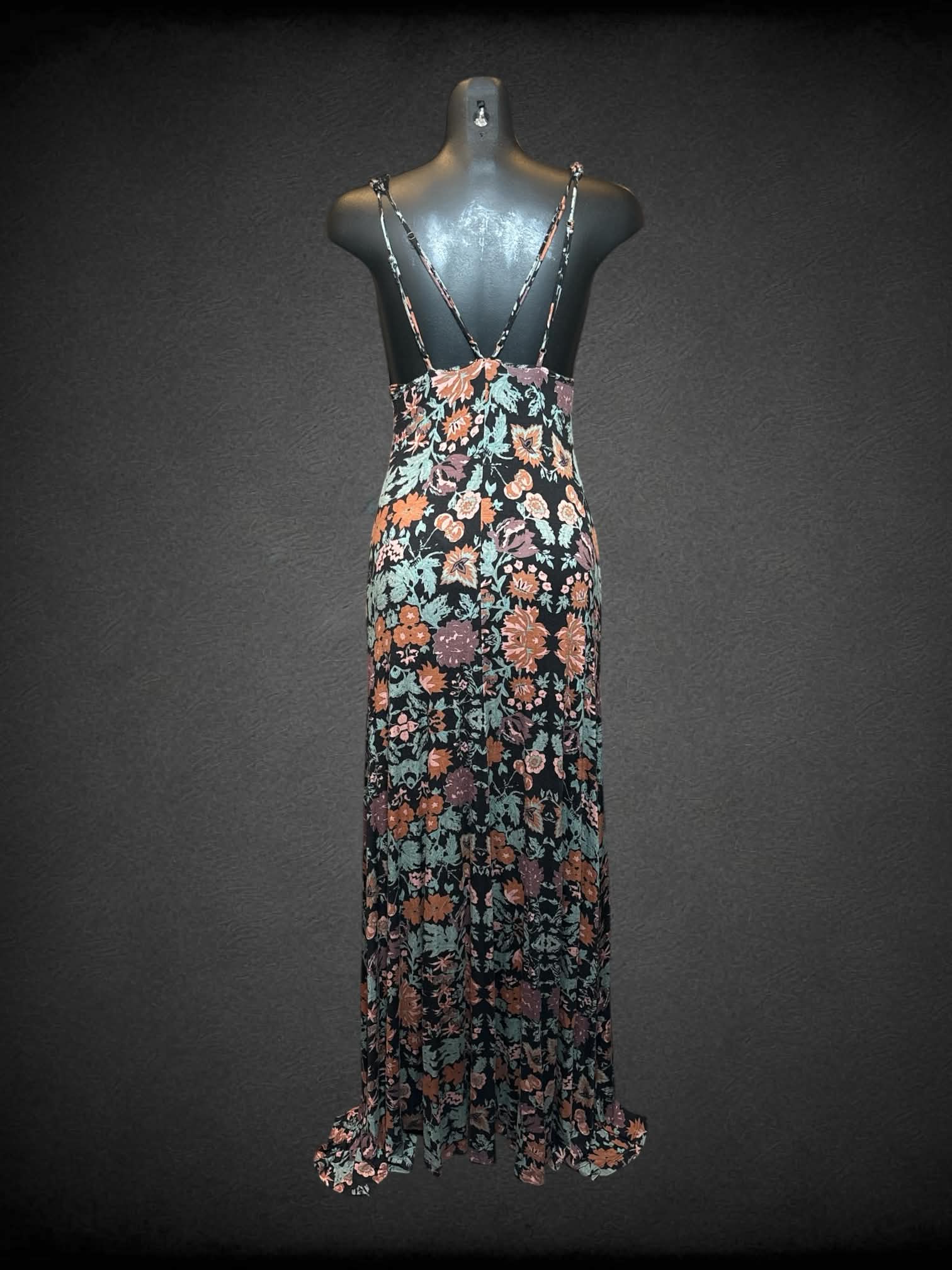 S Free People black dress with green & orange floral pattern, buttons on front and open slit on skirt