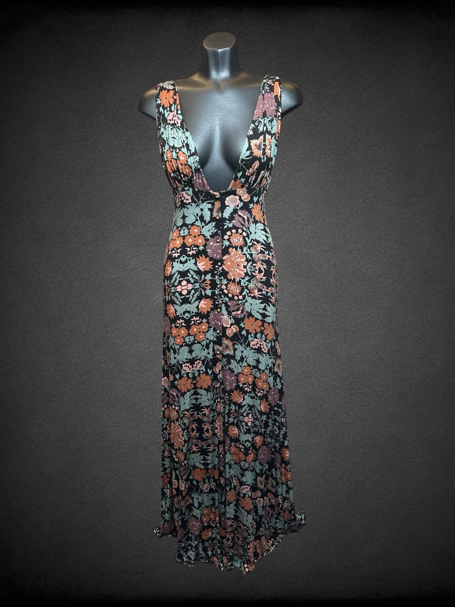 S Free People black dress with green & orange floral pattern, buttons on front and open slit on skirt
