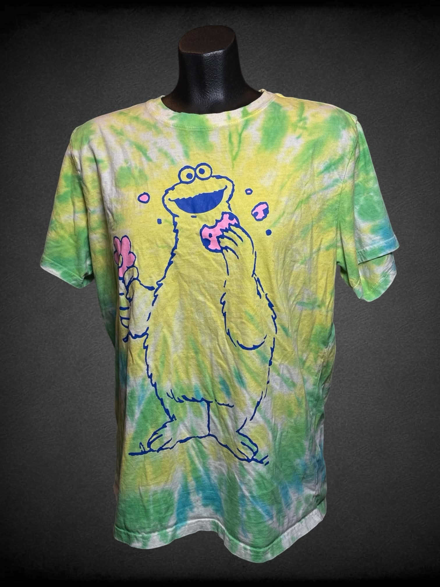 M Sesame Street yellow tie-dye t shirt with “Cookie Monster” graphic on front