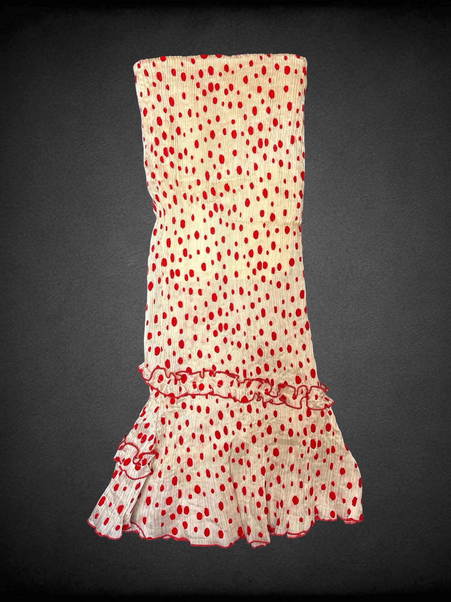 M Tattletale off-white pleated pleated maxi skirt with red polka dot pattern, stretch waist and asymmetrical ruffle cut on front