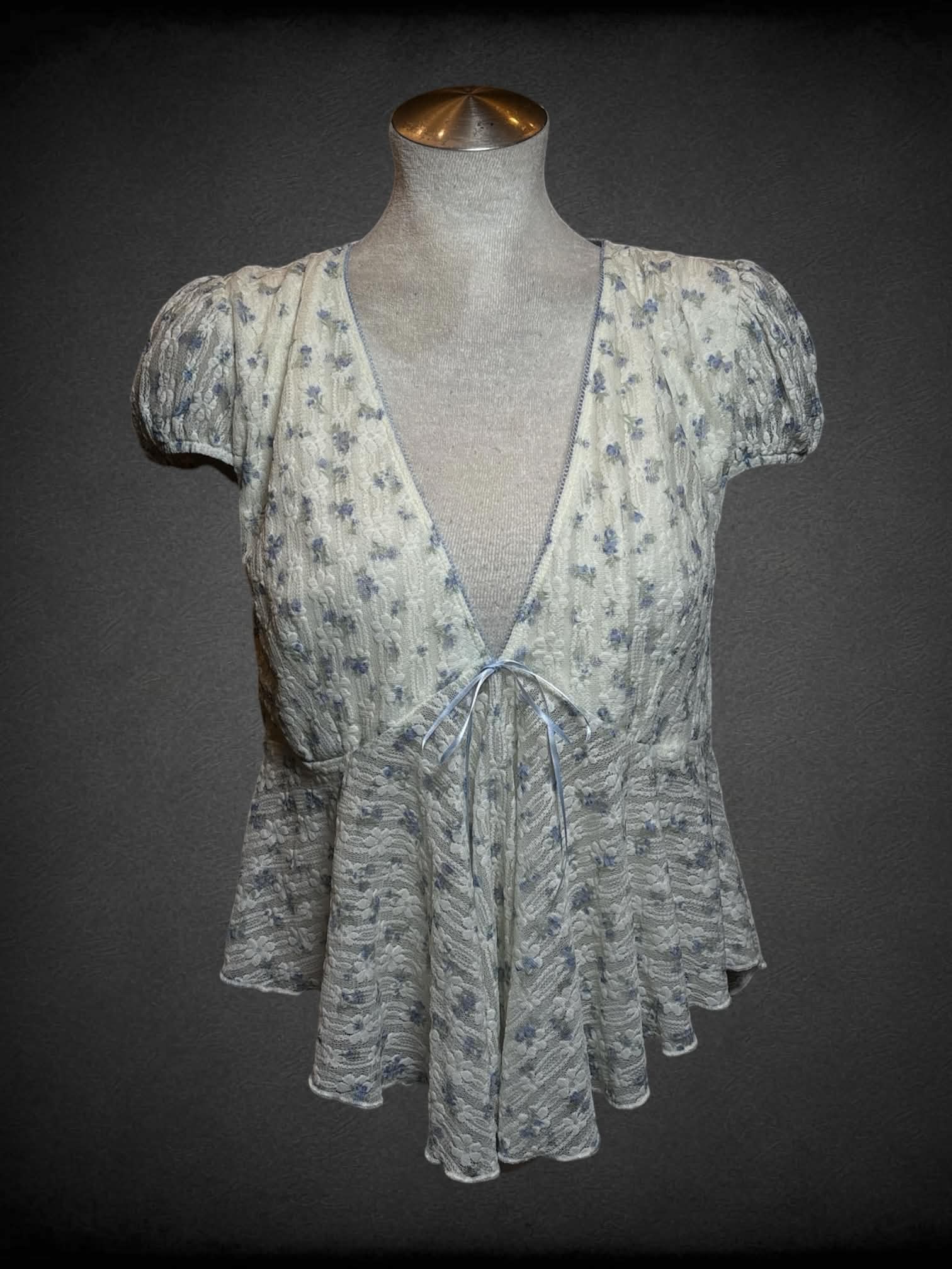 L LoveSick white lace top with blue floral pattern, and empire waist seem