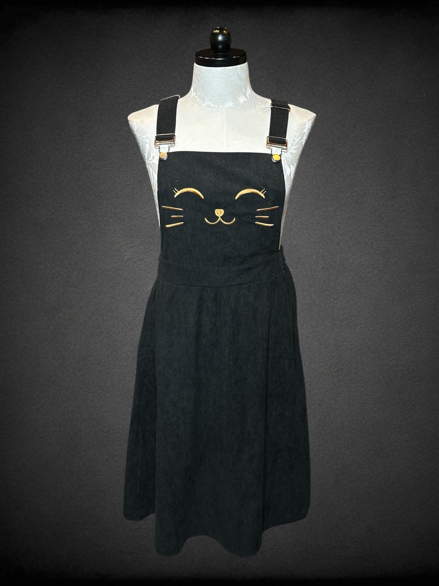 0X Bloom Chic black corduroy overall dress with embroidered cat face on front