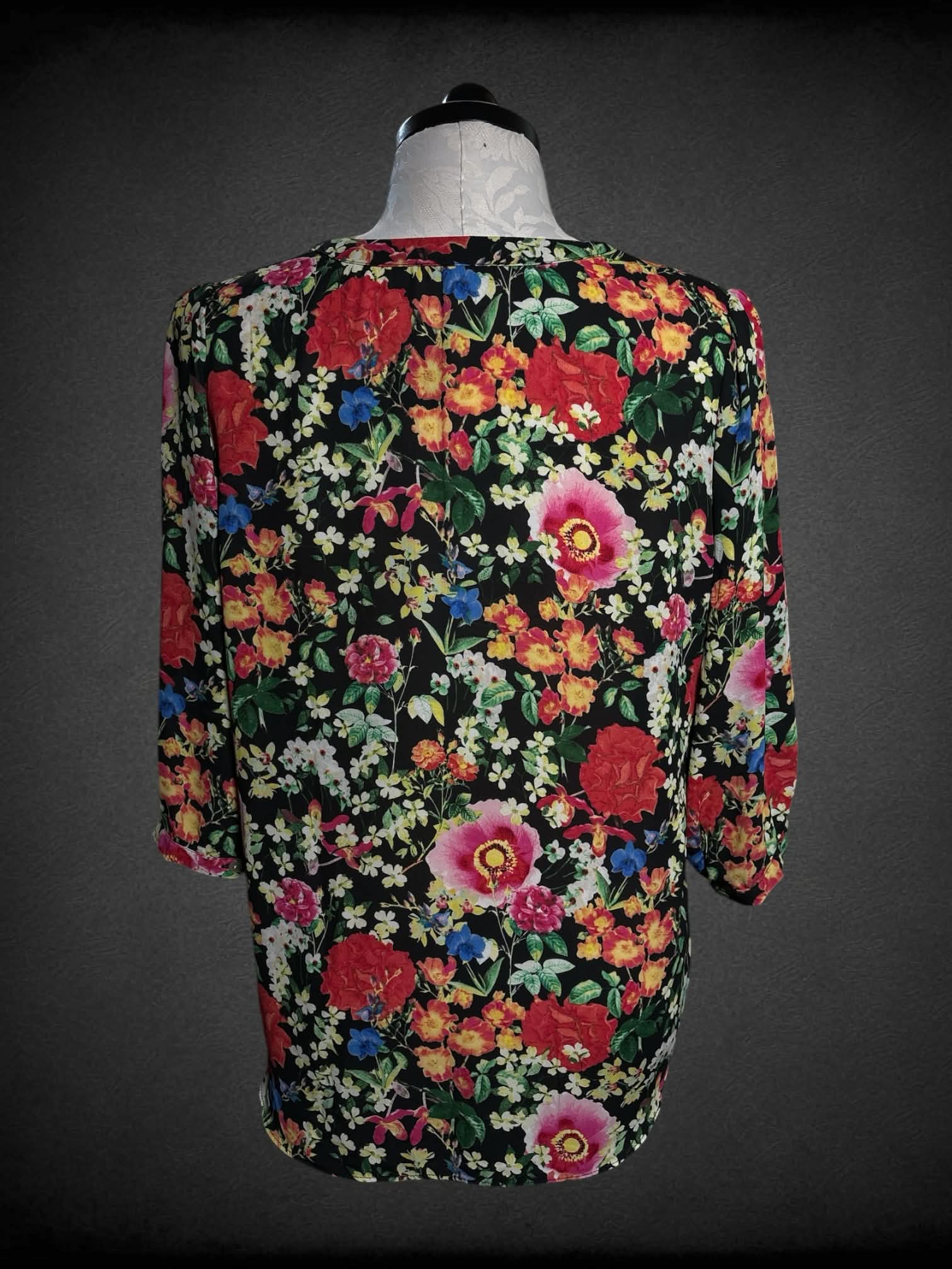 0X Rose + Olive black pleated blouse with a colorful floral pattern, and buttons on front