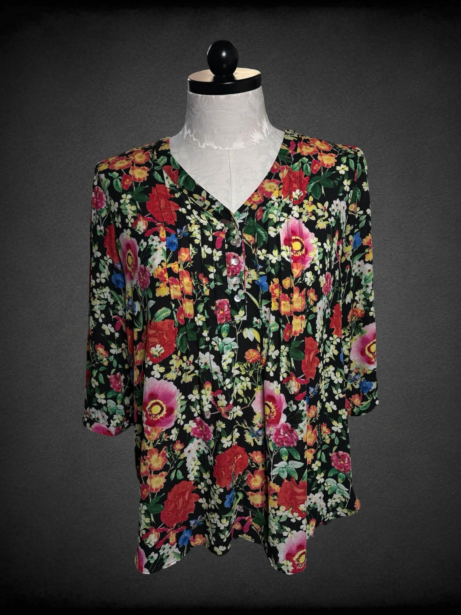 0X Rose + Olive black pleated blouse with a colorful floral pattern, and buttons on front