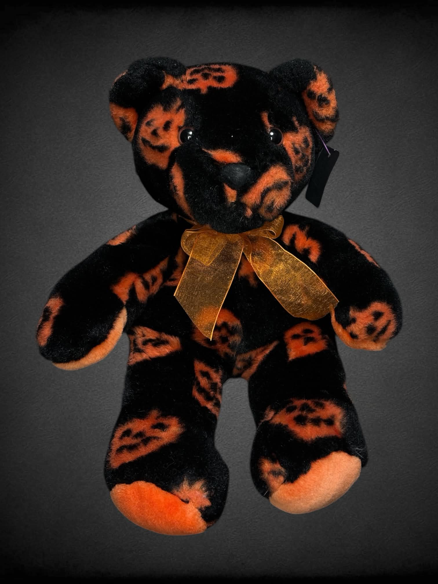 Halloween teddy bear with orange jack-o-lantern pattern