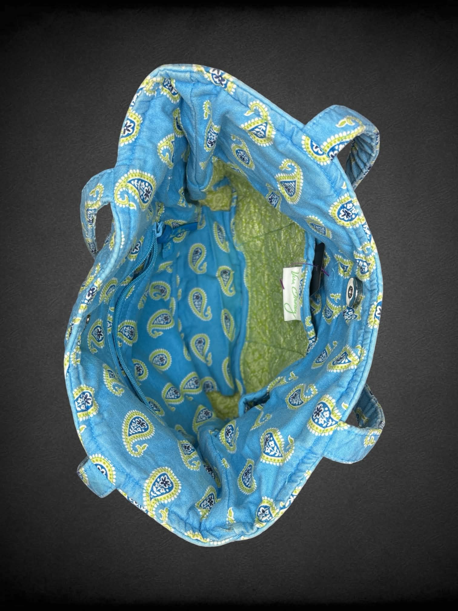 Vera Bradley blue cloth shoulder bag with green paisley design, and zipper pocket on front