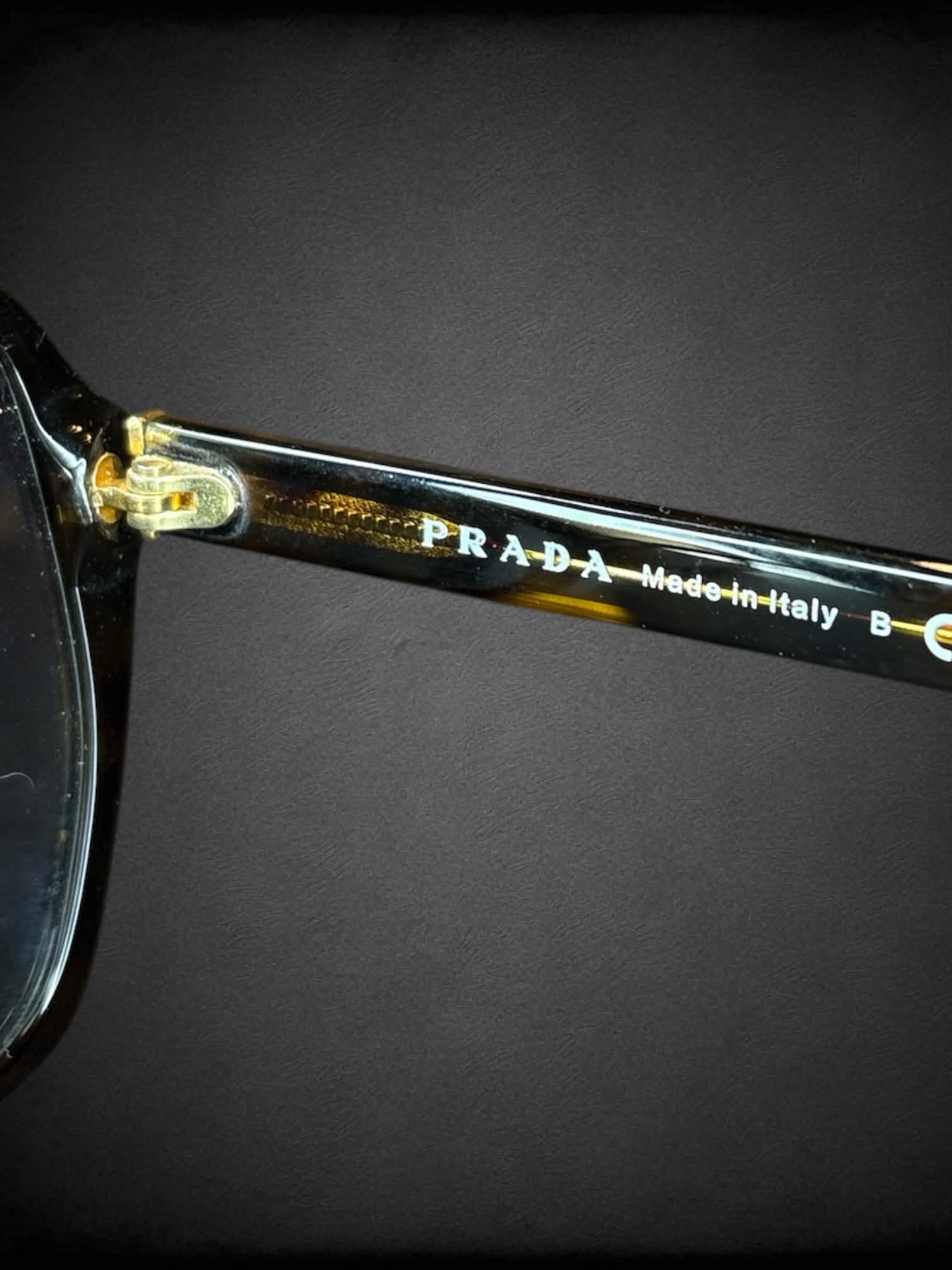Prada SPR 16M sunglasses with polarized brown gradient lenses and Havana tortoiseshell frames