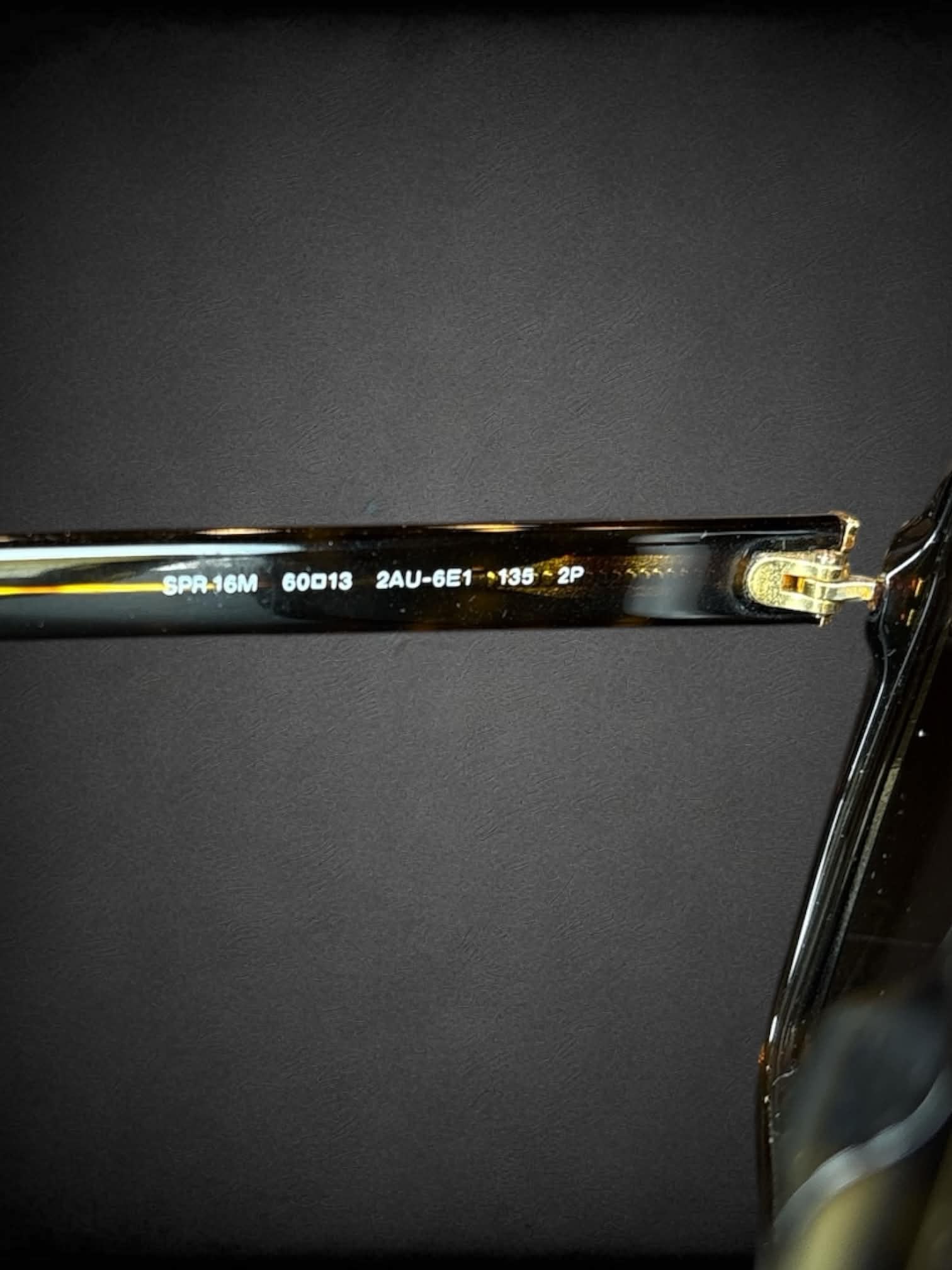 Prada SPR 16M sunglasses with polarized brown gradient lenses and Havana tortoiseshell frames