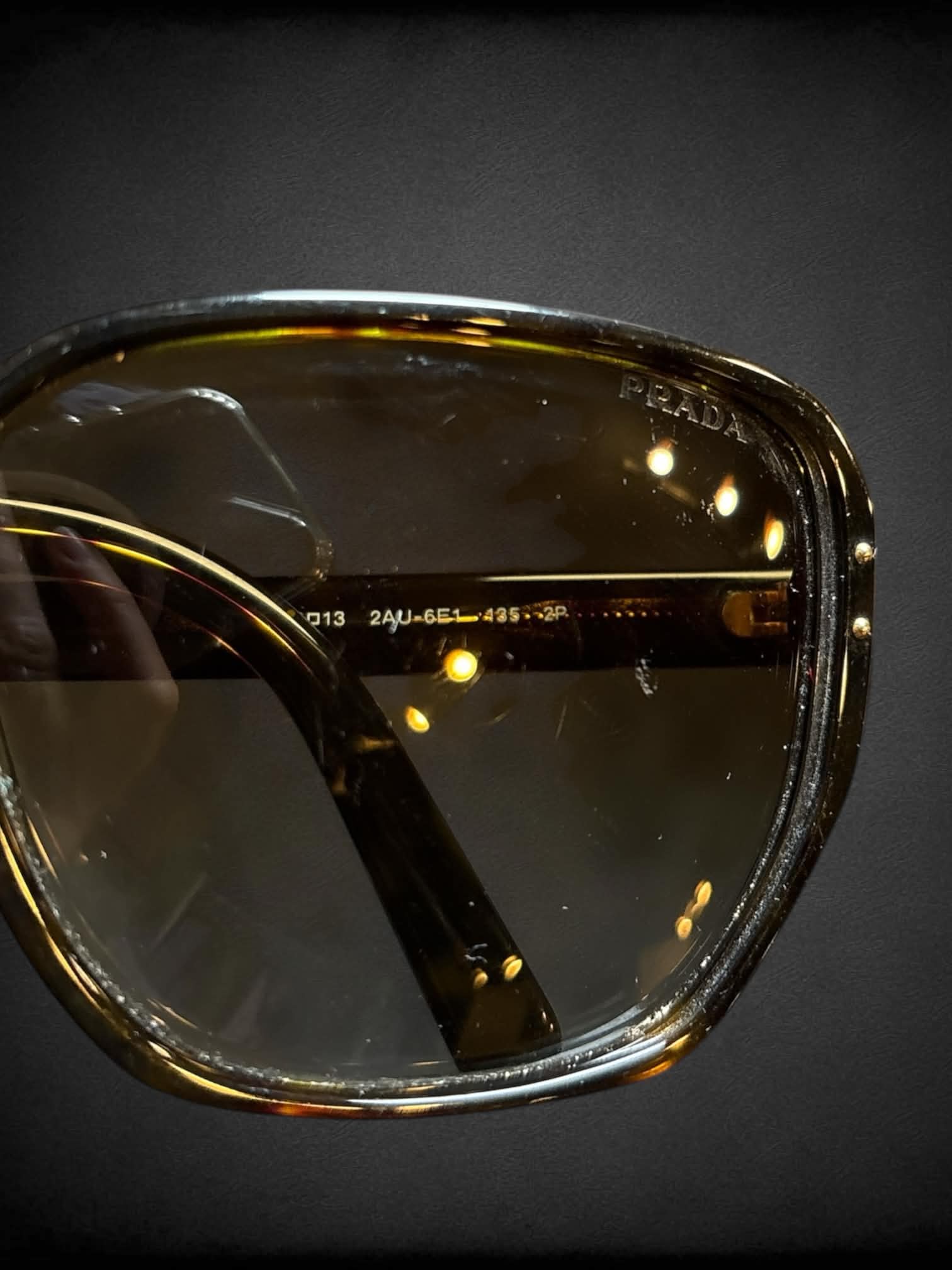 Prada SPR 16M sunglasses with polarized brown gradient lenses and Havana tortoiseshell frames