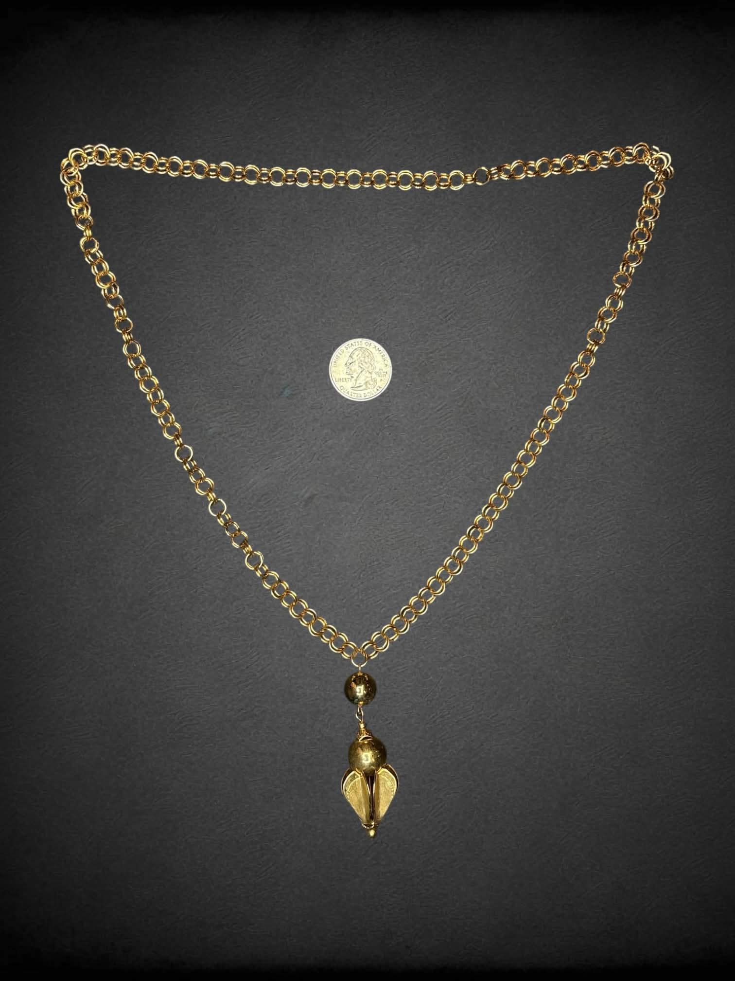 Vintage gold chain with ornamental charm