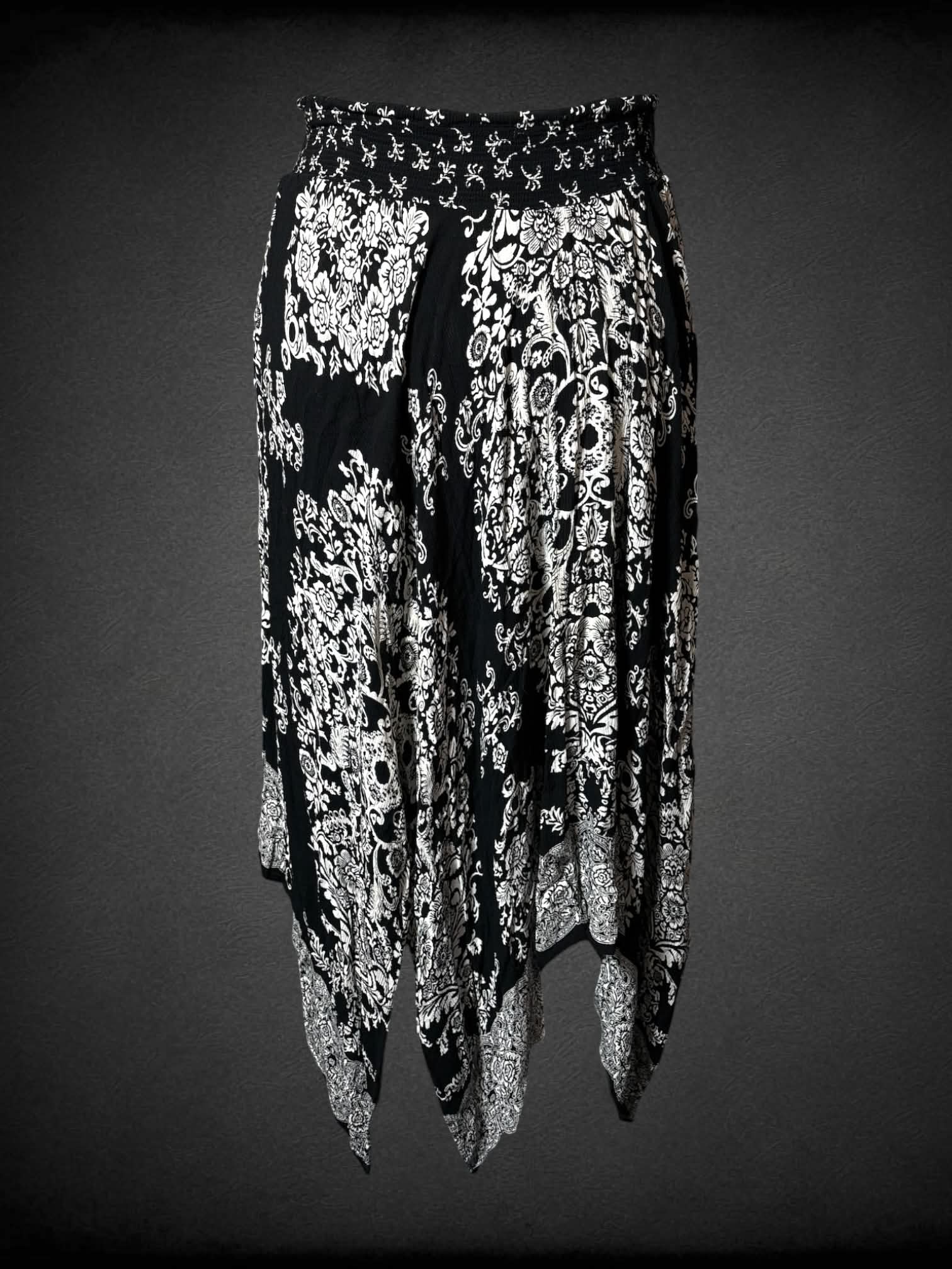 XL Westport black skirt with white ornamental floral pattern, asymmetrical fairy hem and stretch waist