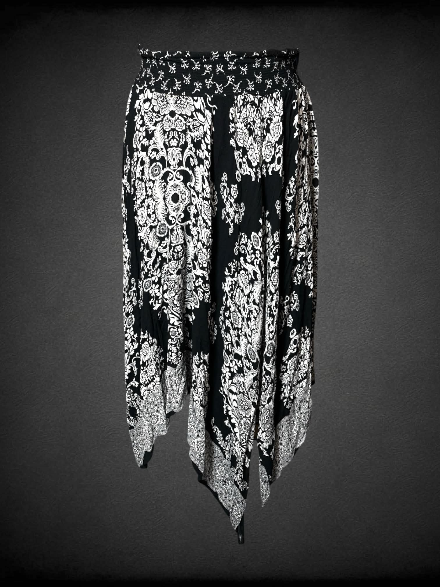 XL Westport black skirt with white ornamental floral pattern, asymmetrical fairy hem and stretch waist