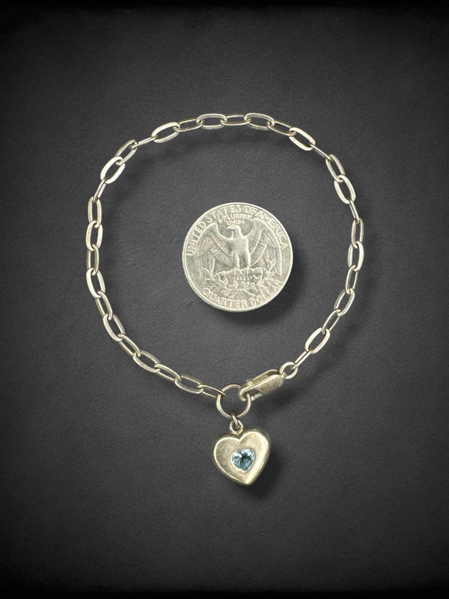 Chain link adjustable bracelet with light blue jeweled heart charm