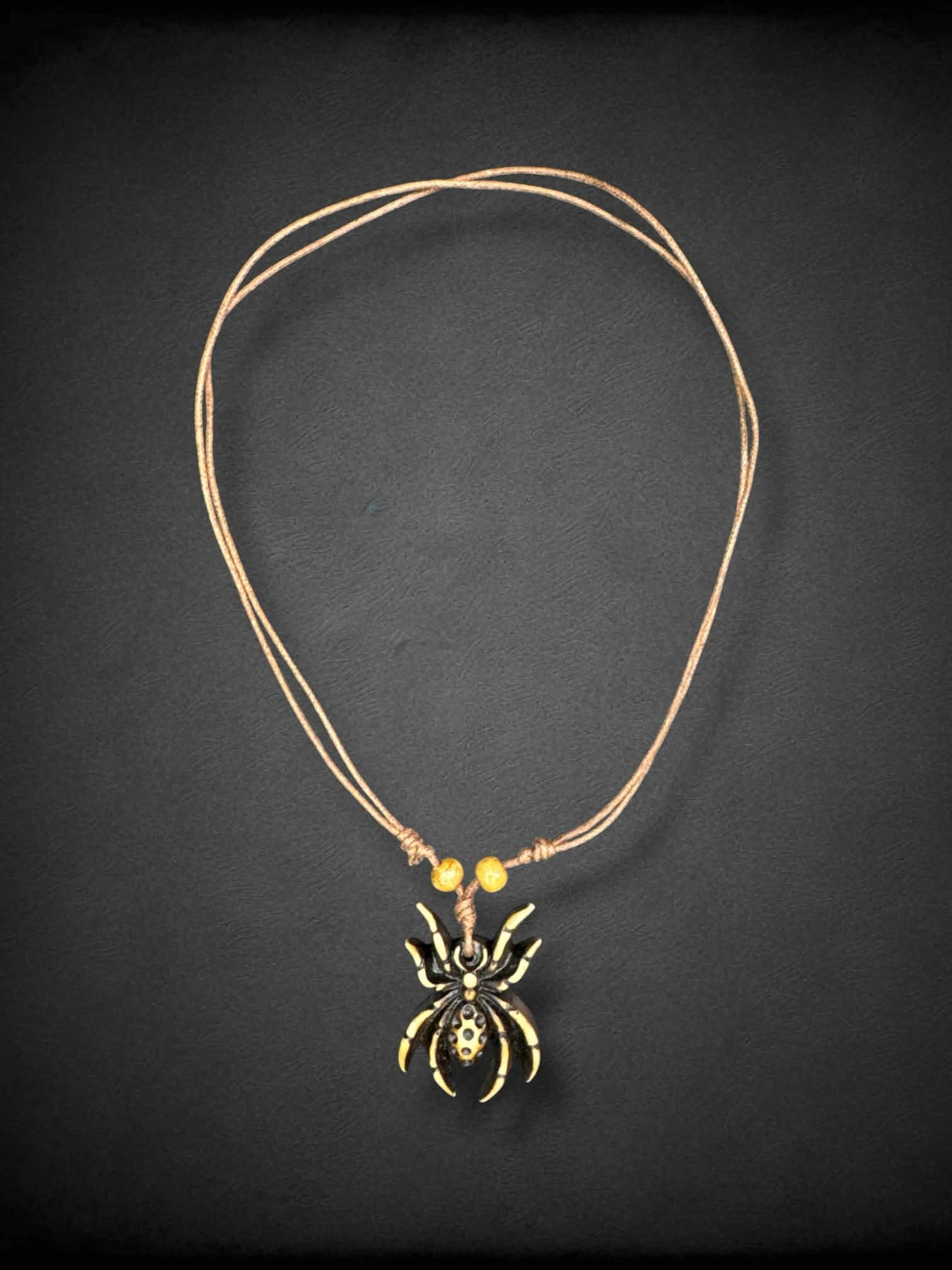 Brown twine adjustable necklace with aged spider pendant