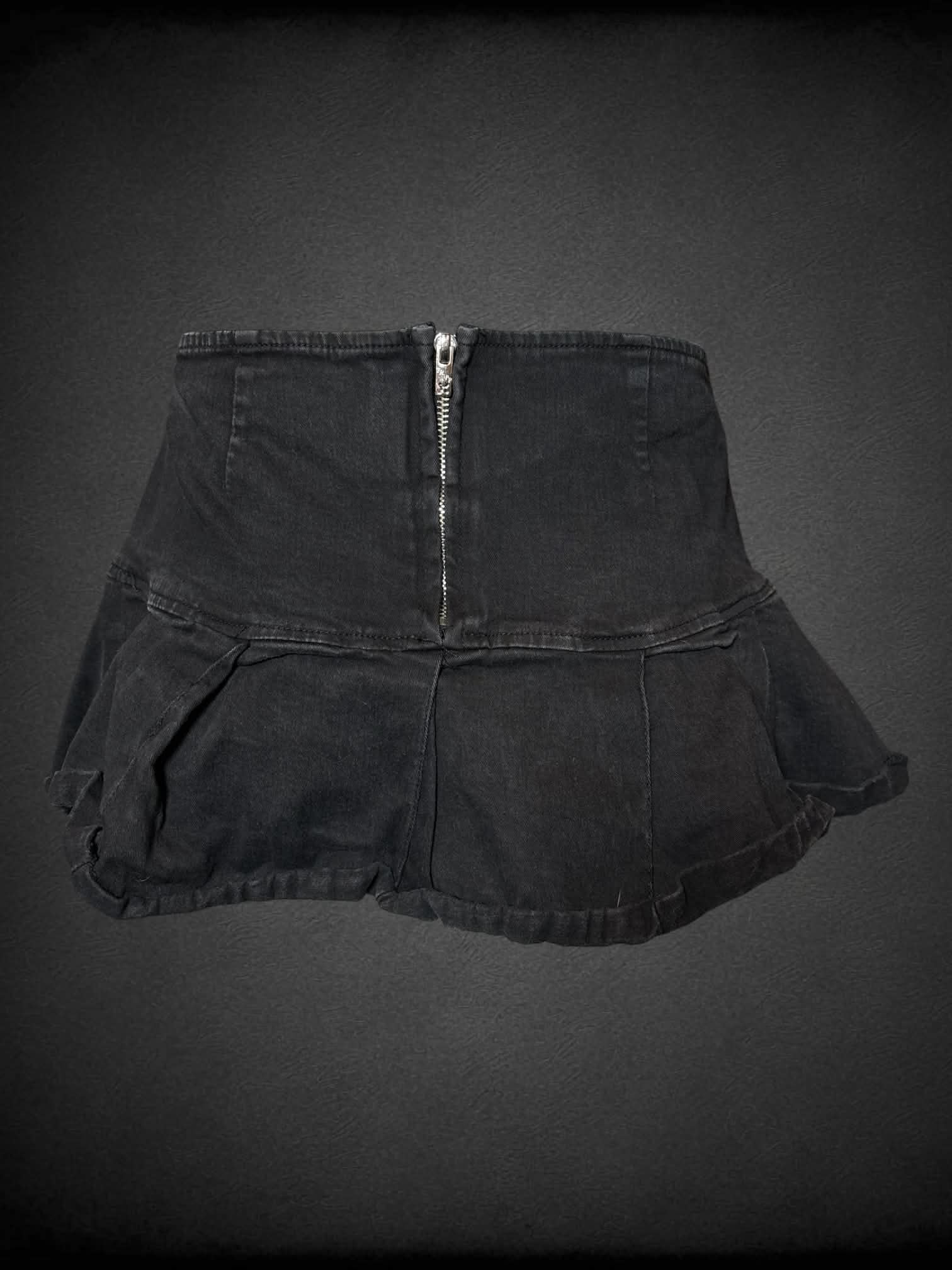 L Tripp NYC black mini skirt with decorative buttons on front, and zipper on back