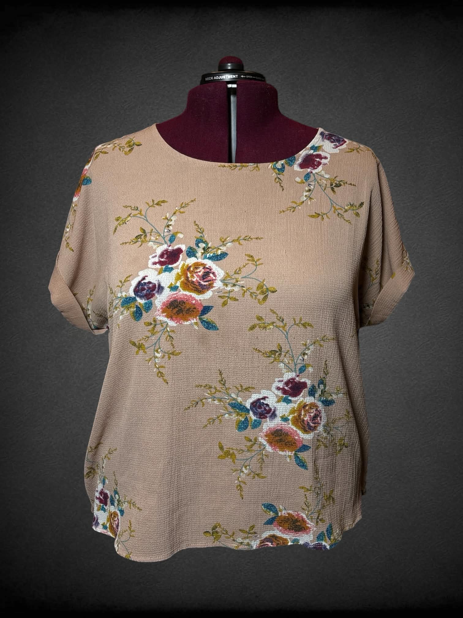 2X tan blouse with colorful floral pattern, and button on back