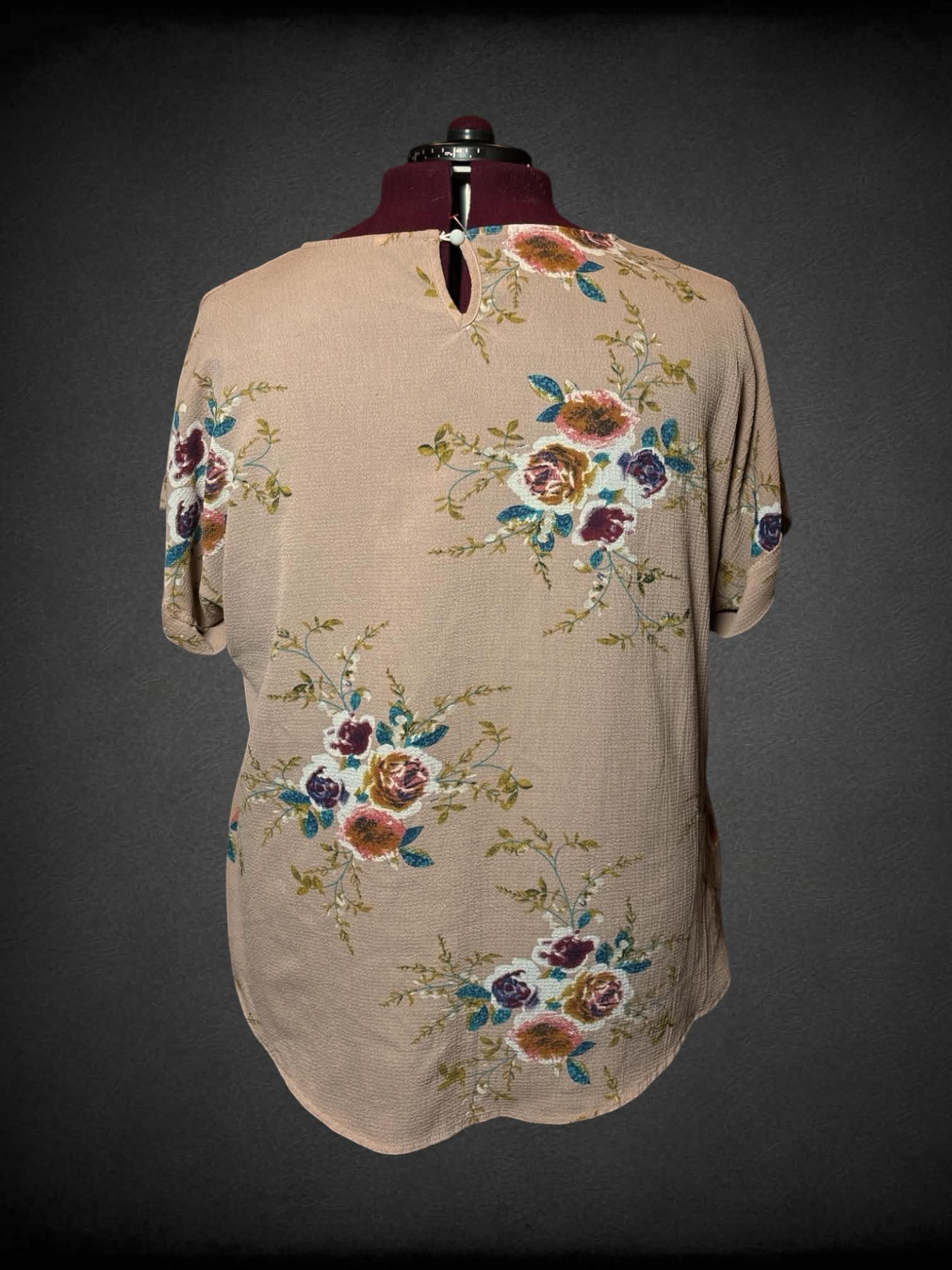 2X tan blouse with colorful floral pattern, and button on back