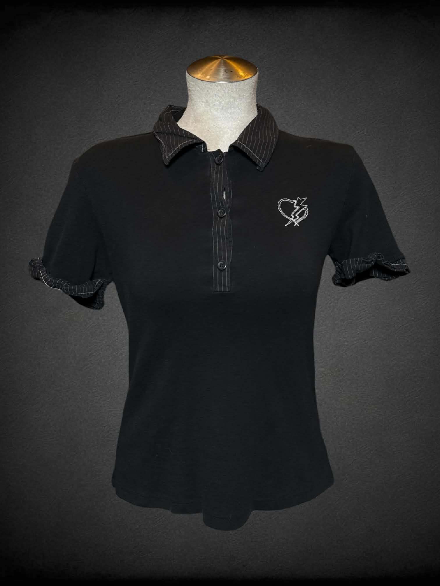L Morbid Threads vintage black polo shirt with striped collar and cuffed sleeves, and sewn heart with lightnight bolt graphic on front