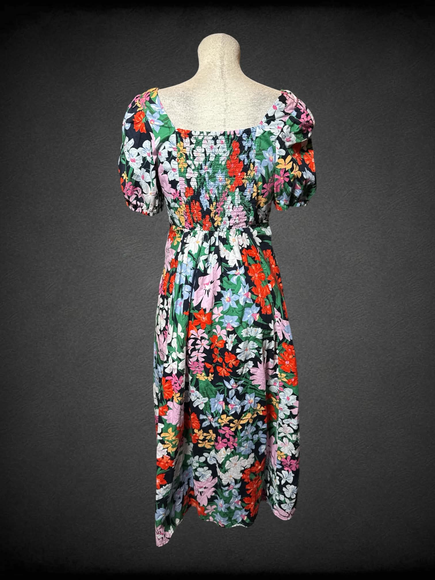 L Old Navy blue sundress with colorful floral pattern, pockets and shirred back