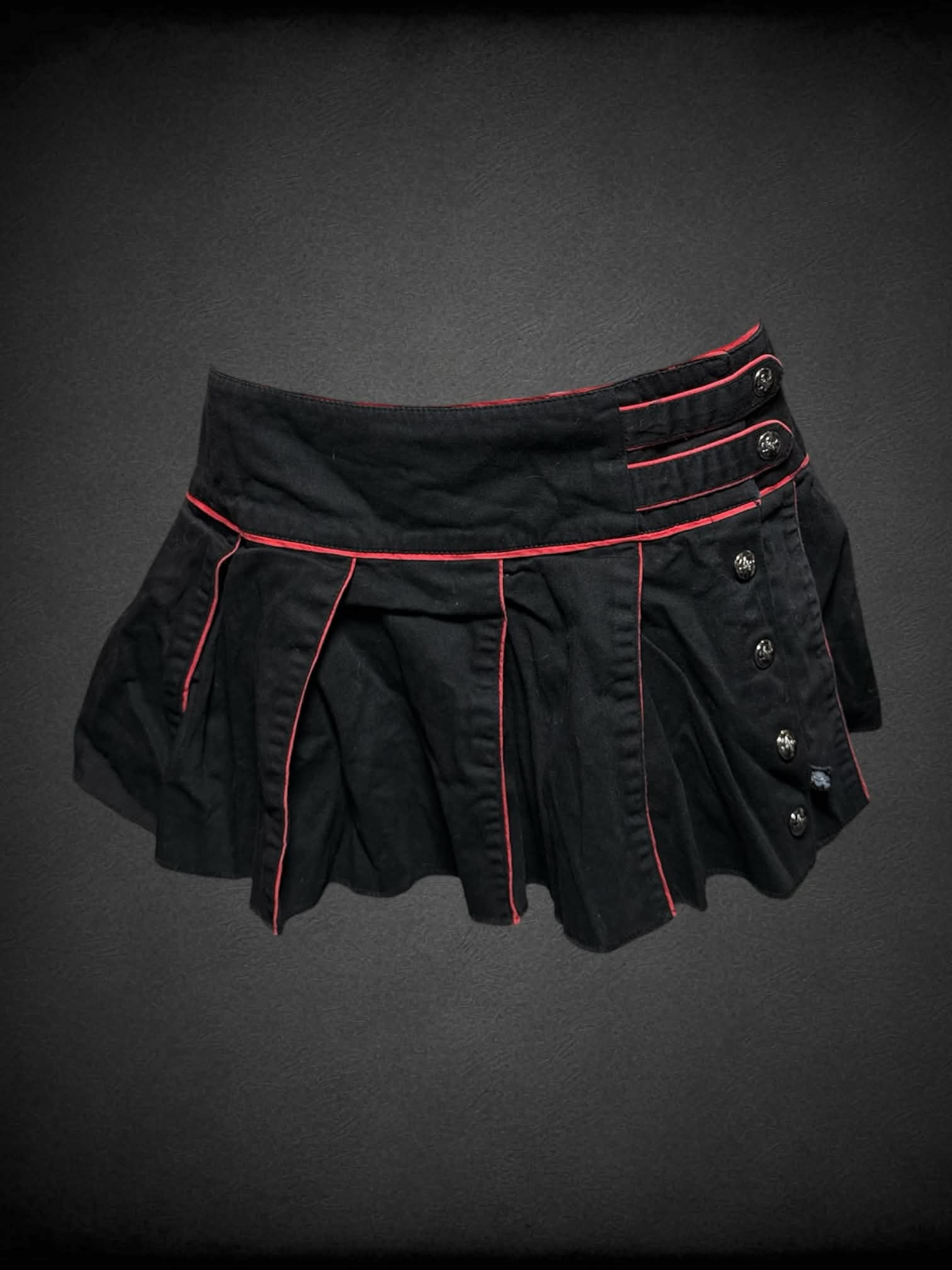 L Tripp NYC black pleated mini skirt with red trimming, and buttons going up side