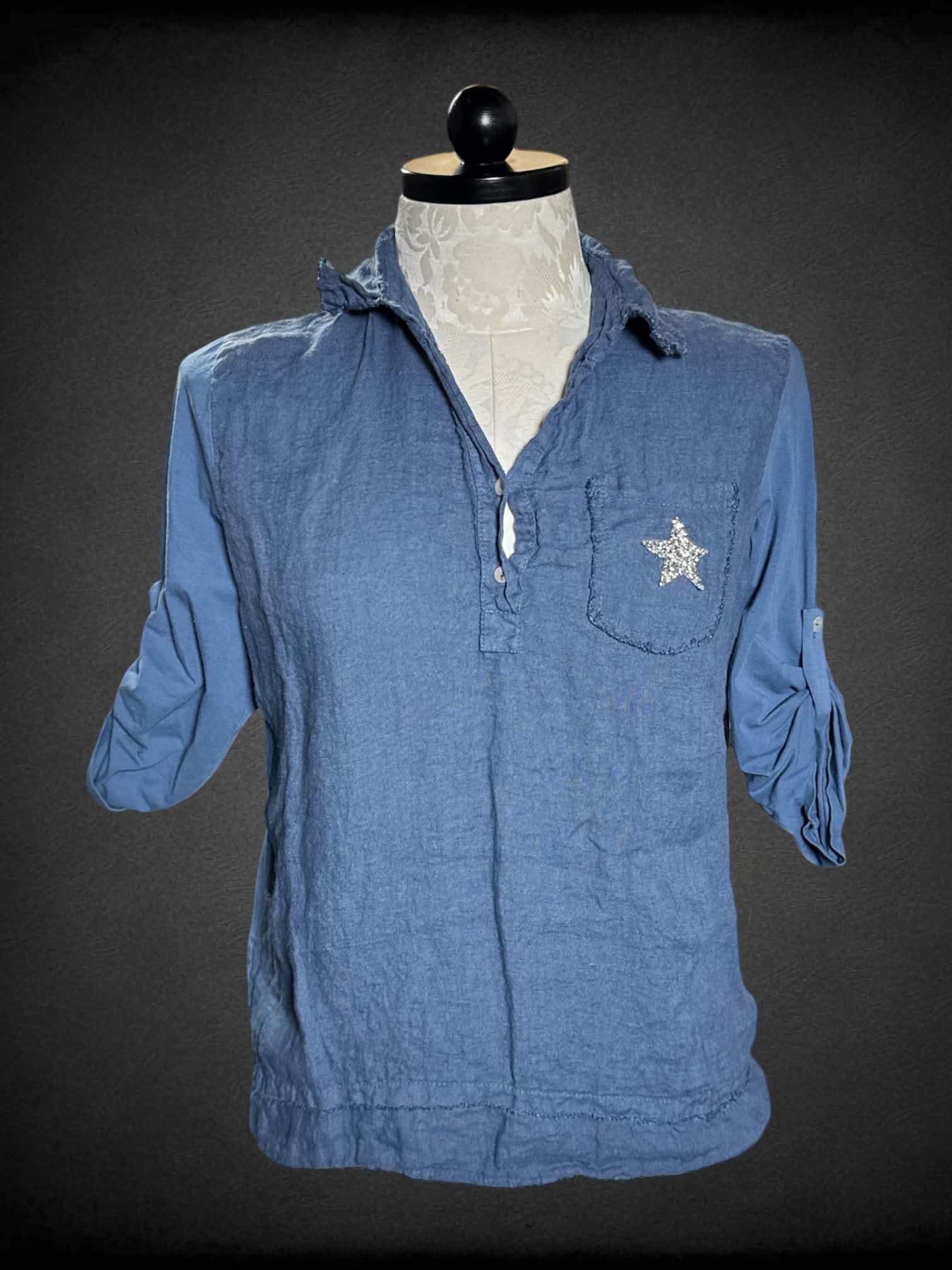 0X Femme Fatale blue shirt with buttons on front and sparkly star on pocket