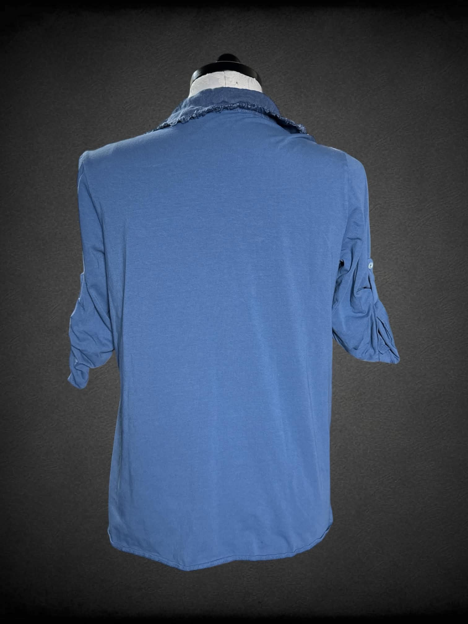 0X Femme Fatale blue shirt with buttons on front and sparkly star on pocket