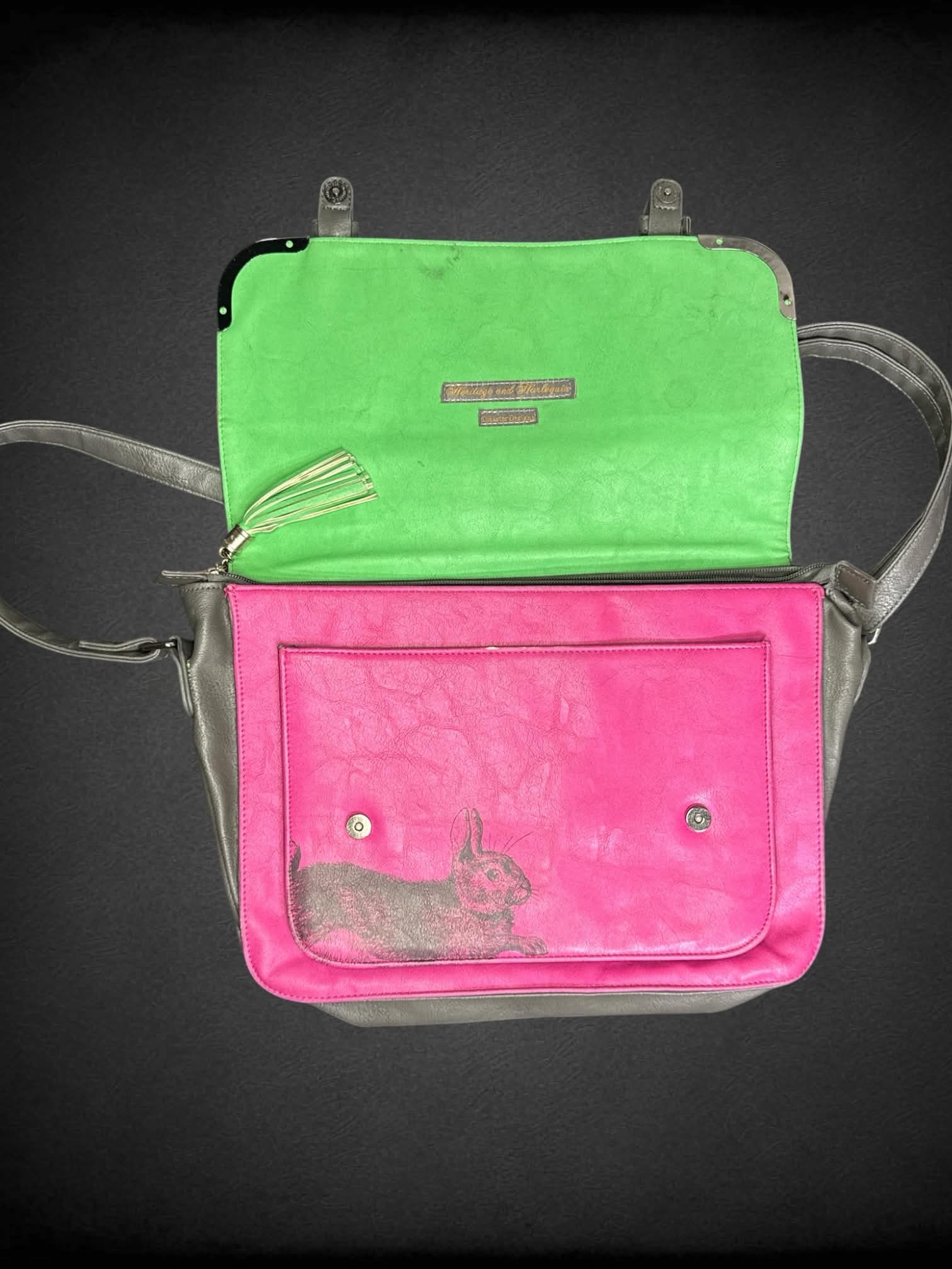 Heritage and Harlequin pink shoulder bag with bunny graphic on front, magnetic snap buttons and zipper pockets