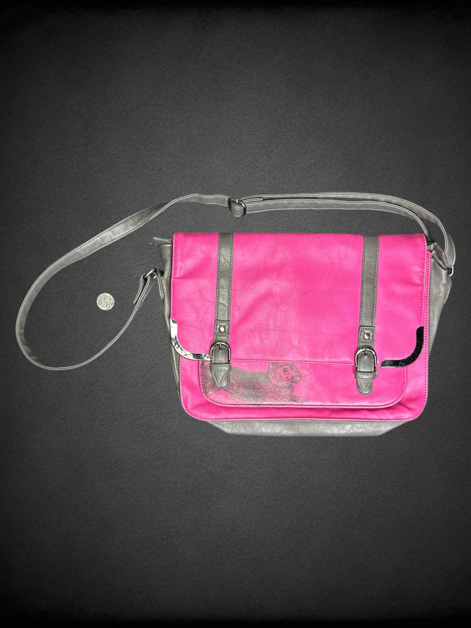 Heritage and Harlequin pink shoulder bag with bunny graphic on front, magnetic snap buttons and zipper pockets