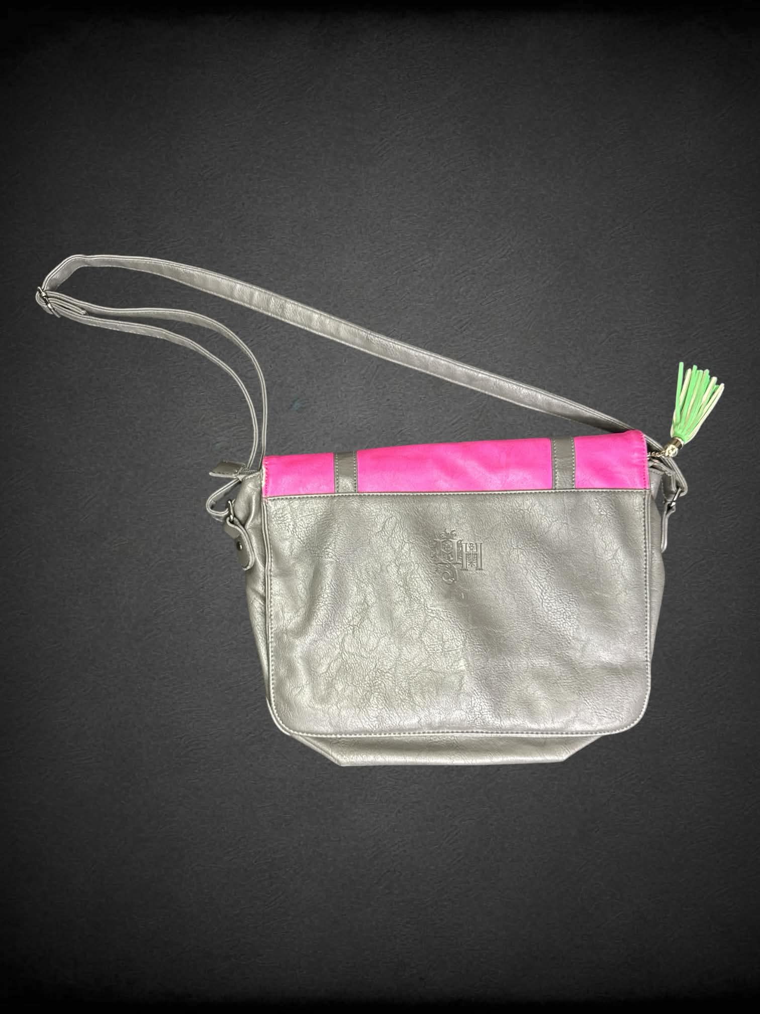 Heritage and Harlequin pink shoulder bag with bunny graphic on front, magnetic snap buttons and zipper pockets