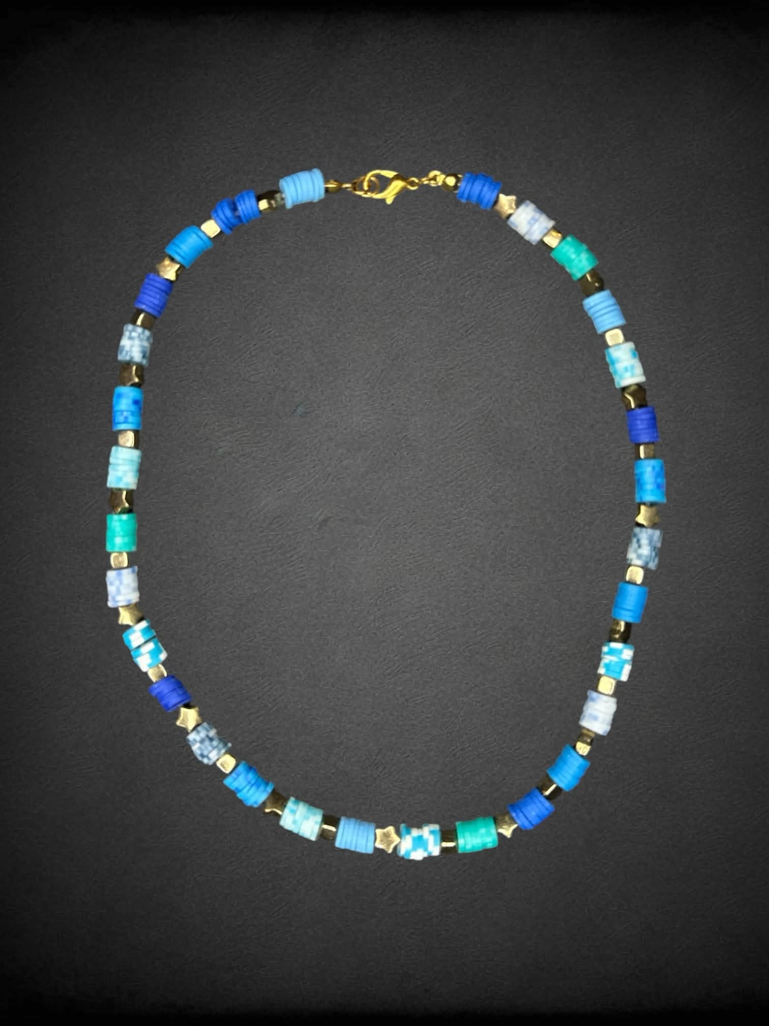 Blue beaded necklace with gold star charms