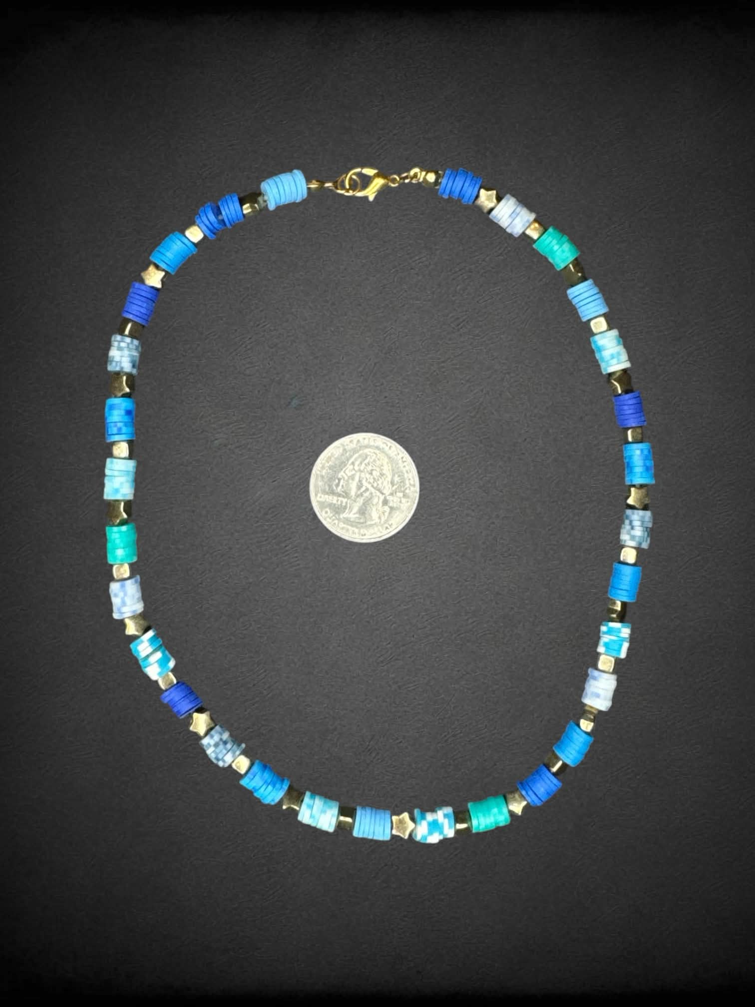 Blue beaded necklace with gold star charms