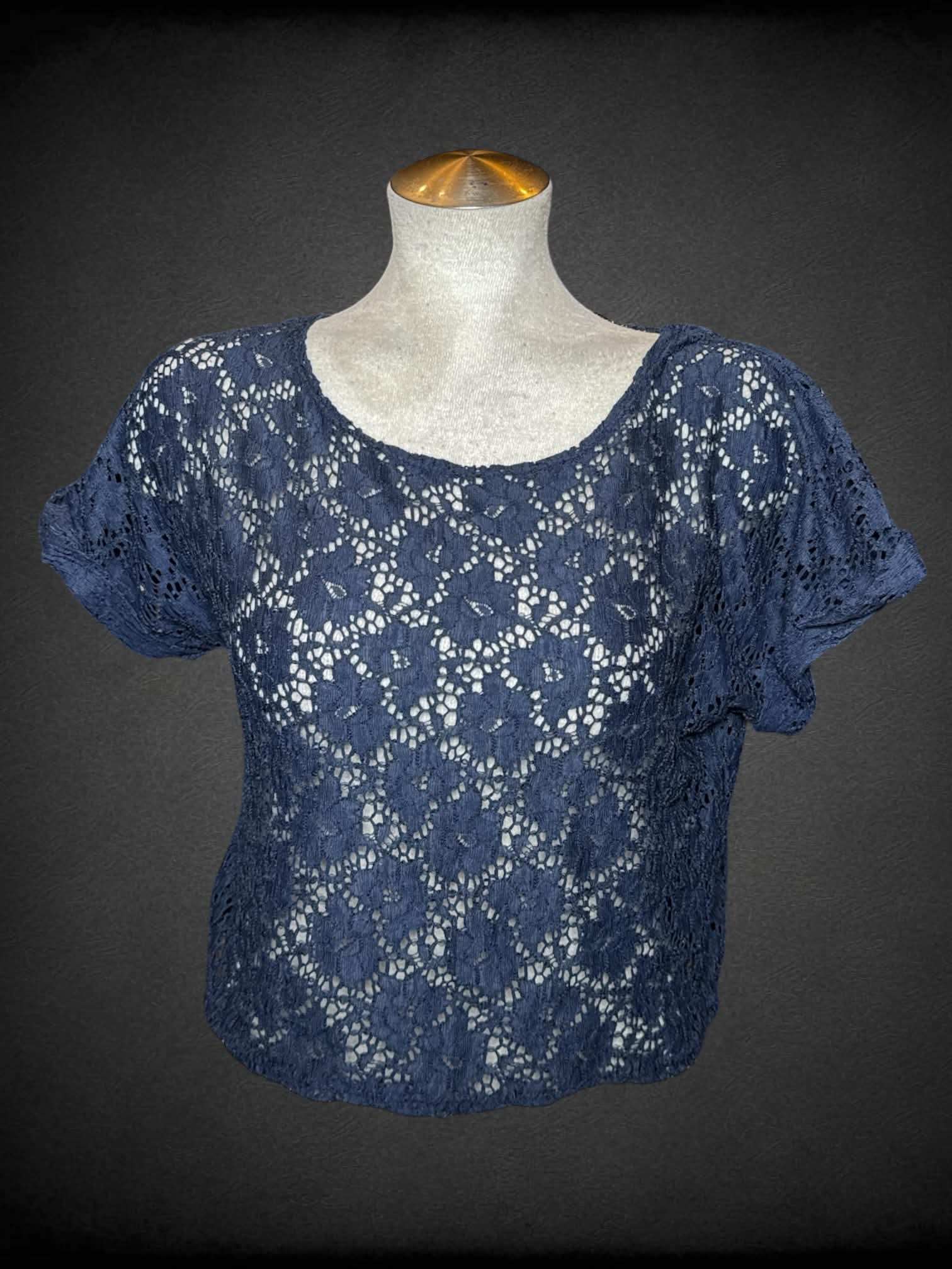 L Delia’s navy blue knit top with embroidered floral design