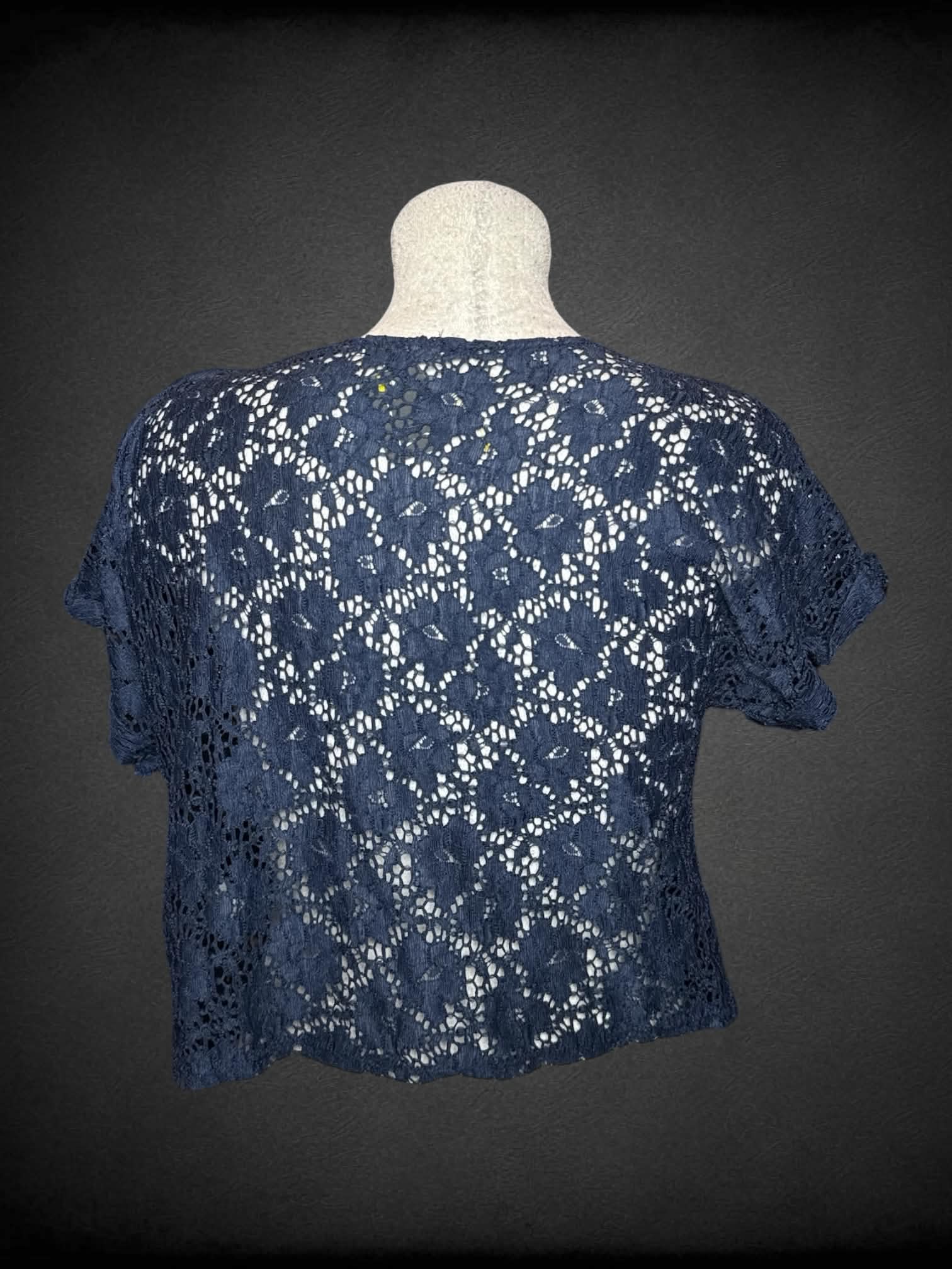 L Delia’s navy blue knit top with embroidered floral design