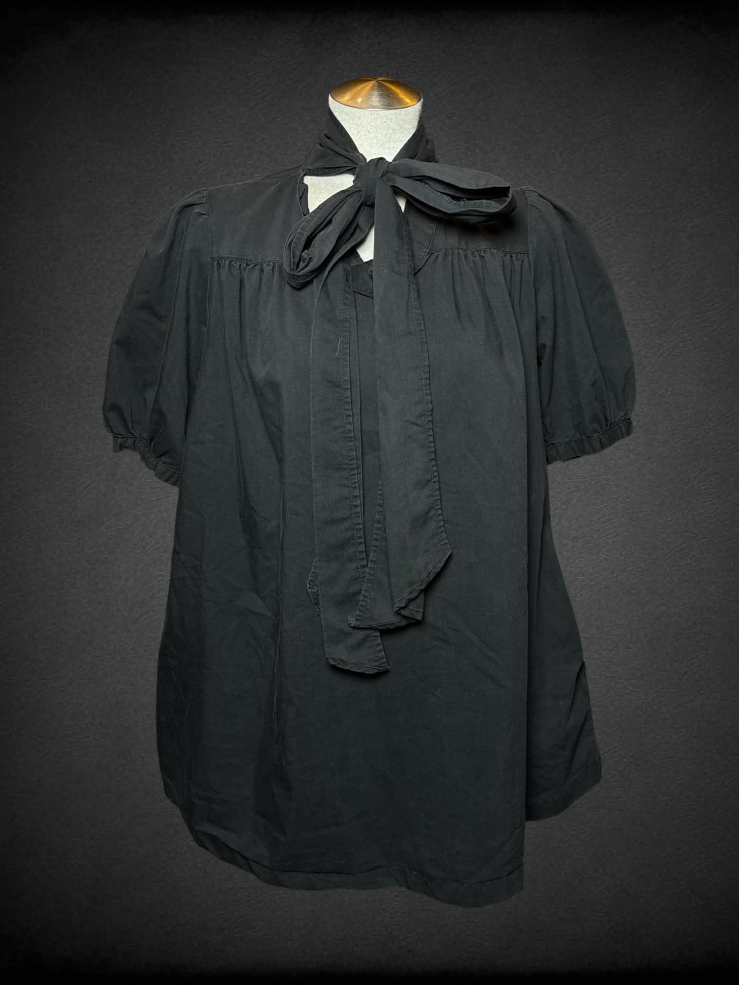 L Bitten black flowy dress with pockets, and tie up neck