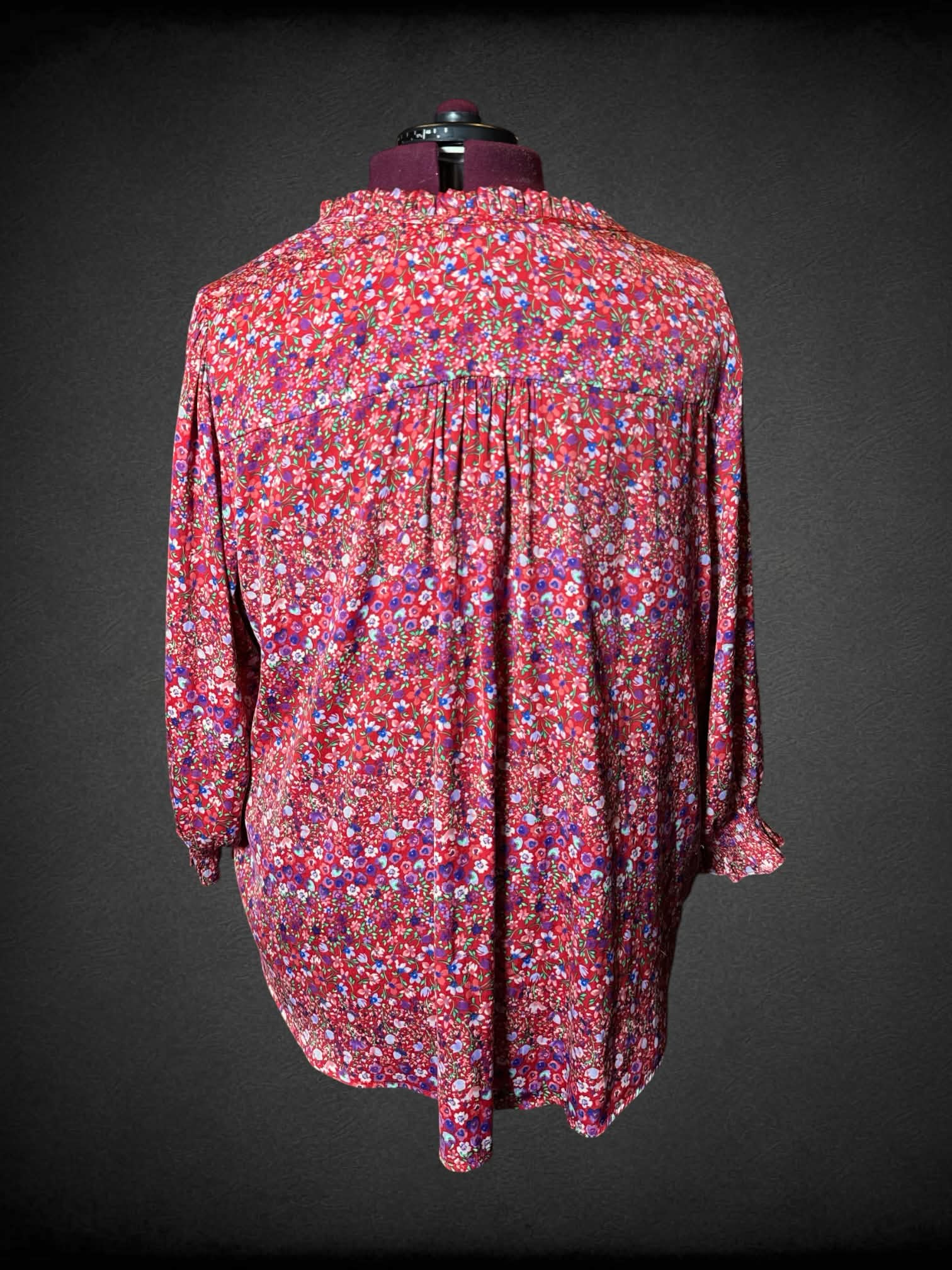 3X Carolina Belle red flowy blouse with colorful floral pattern, and adjustable tie on neck