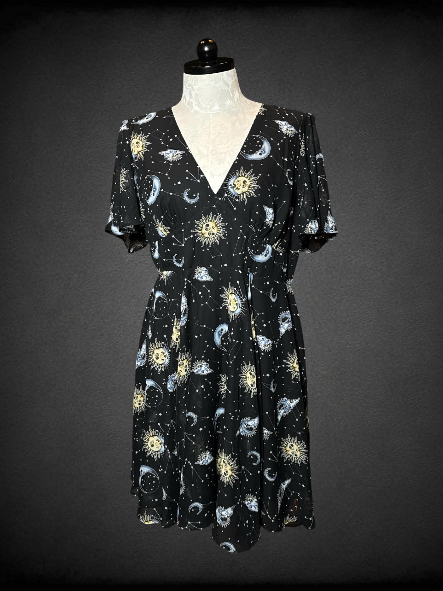 0X Hell Bunny black dress with star, moon and constellation pattern, and zipper on back