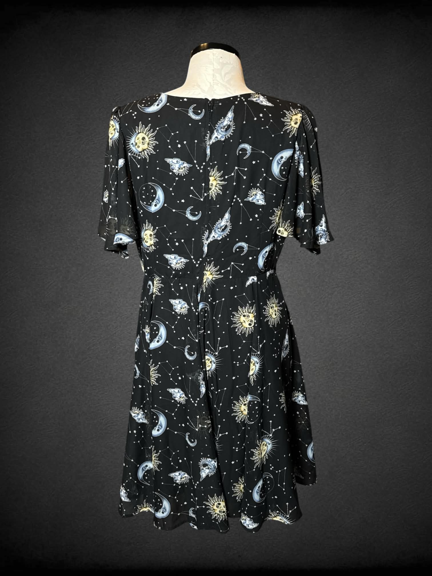 0X Hell Bunny black dress with star, moon and constellation pattern, and zipper on back
