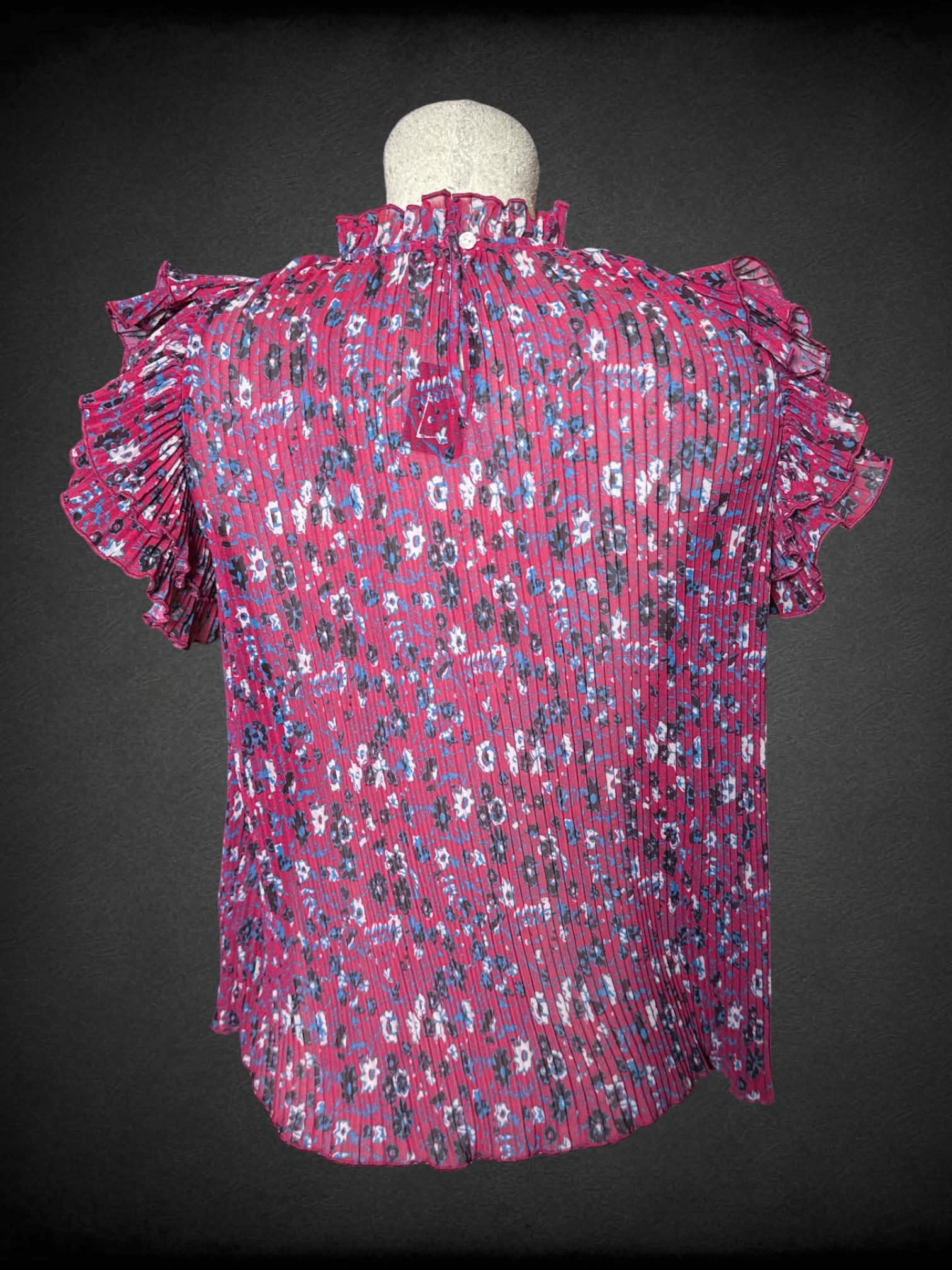 L Anthropologie red sheer pleated blouse with floral pattern, ruffle sleeves, and button on back