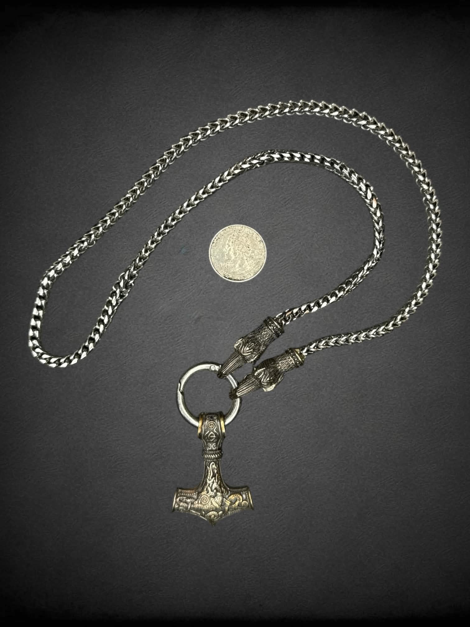 Heavy silver chain with anchor and bird head charms