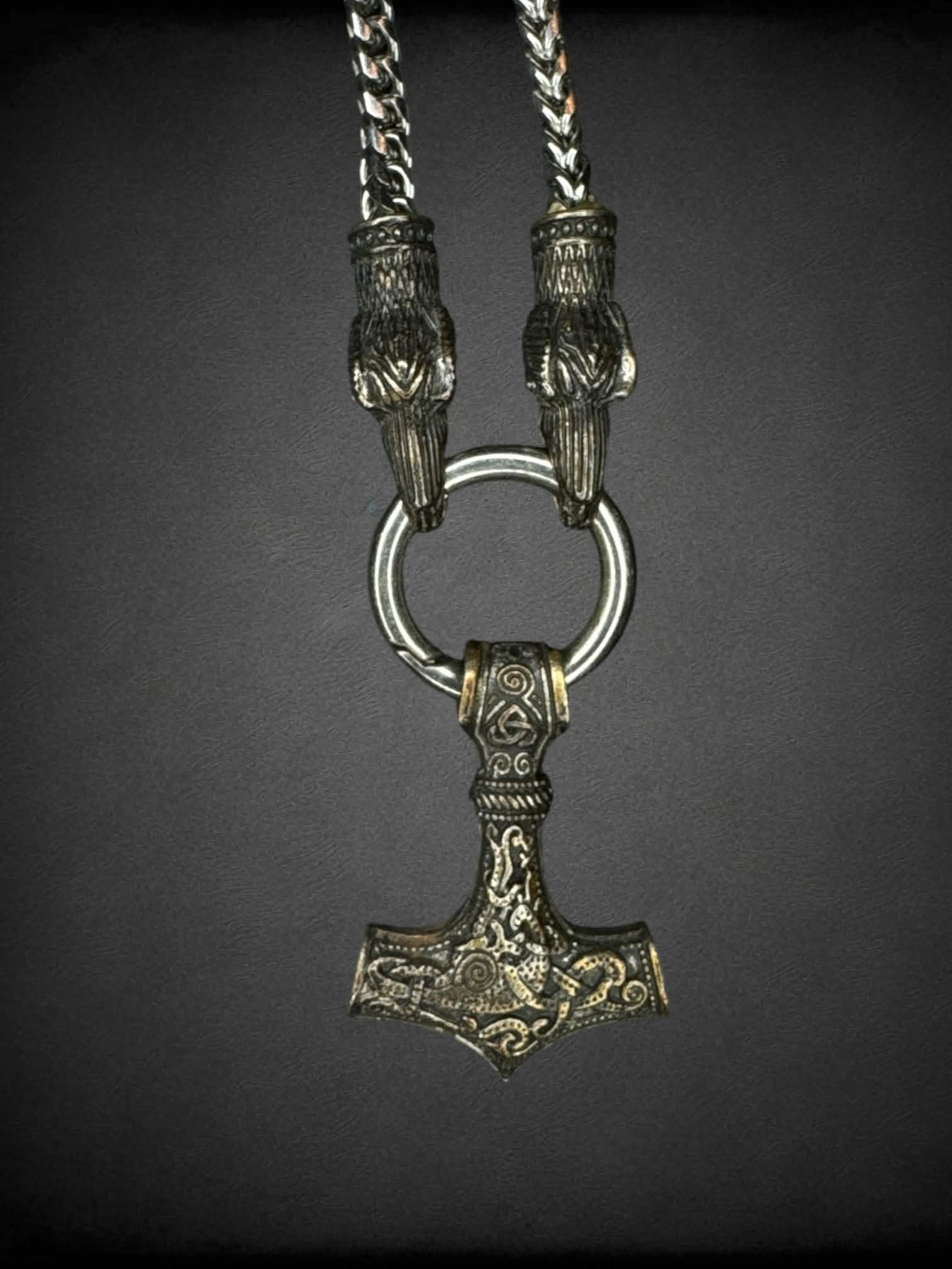 Heavy silver chain with anchor and bird head charms