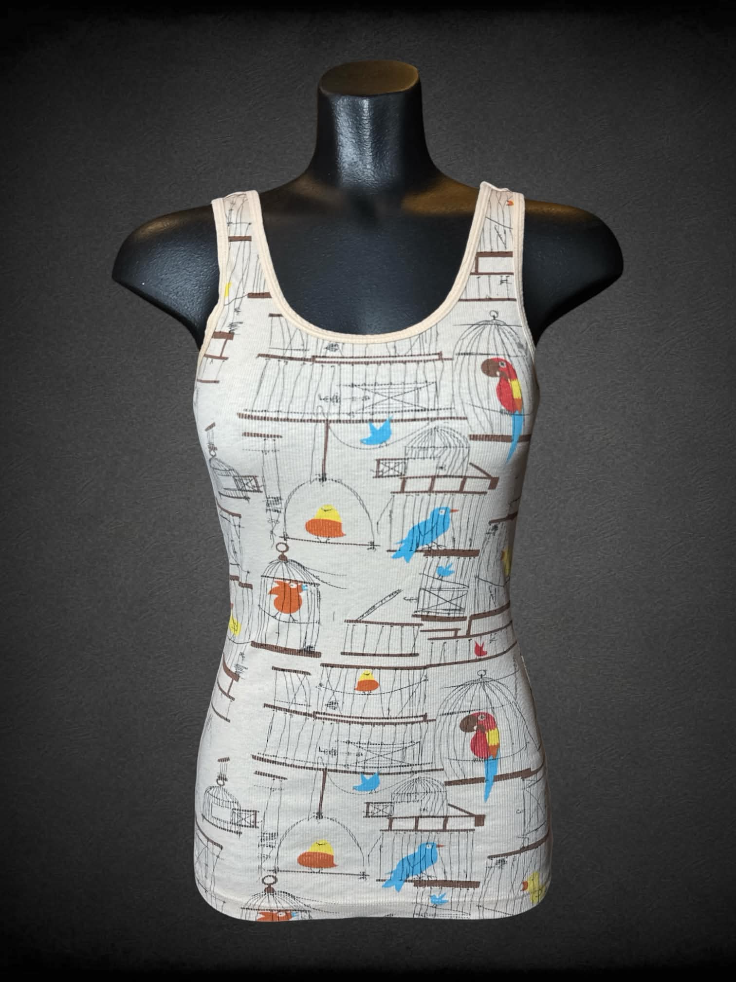 M Delia’s tan ribbed tank top with bird pattern