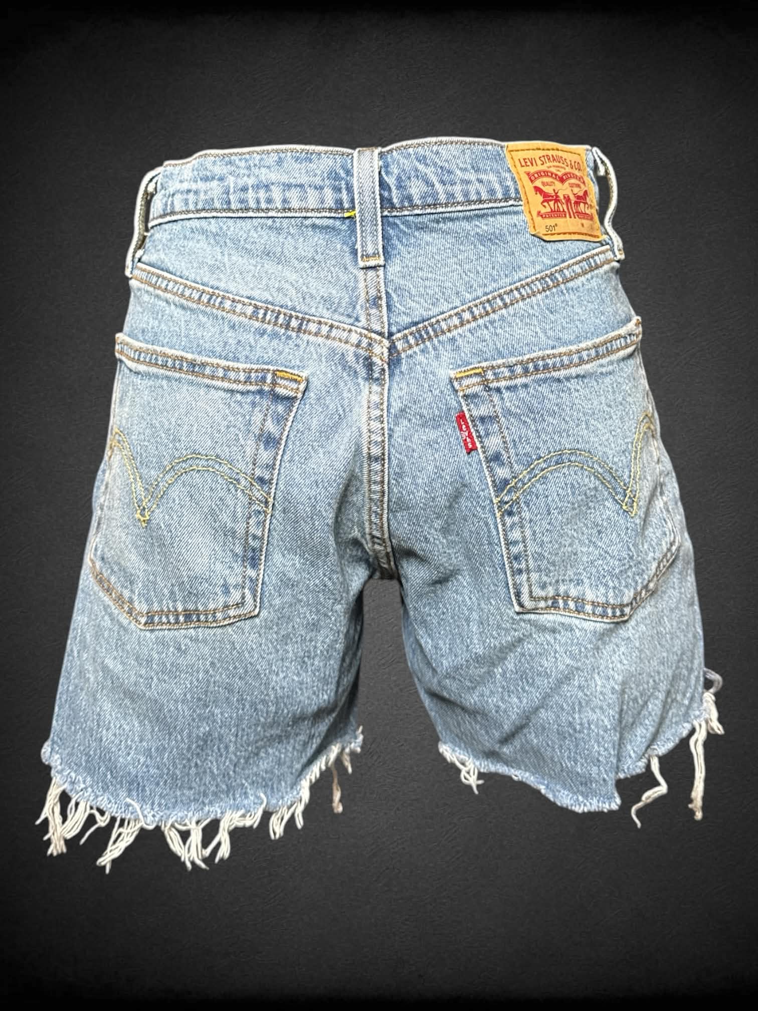 M Levi’s blue denim shorts with distressed hem