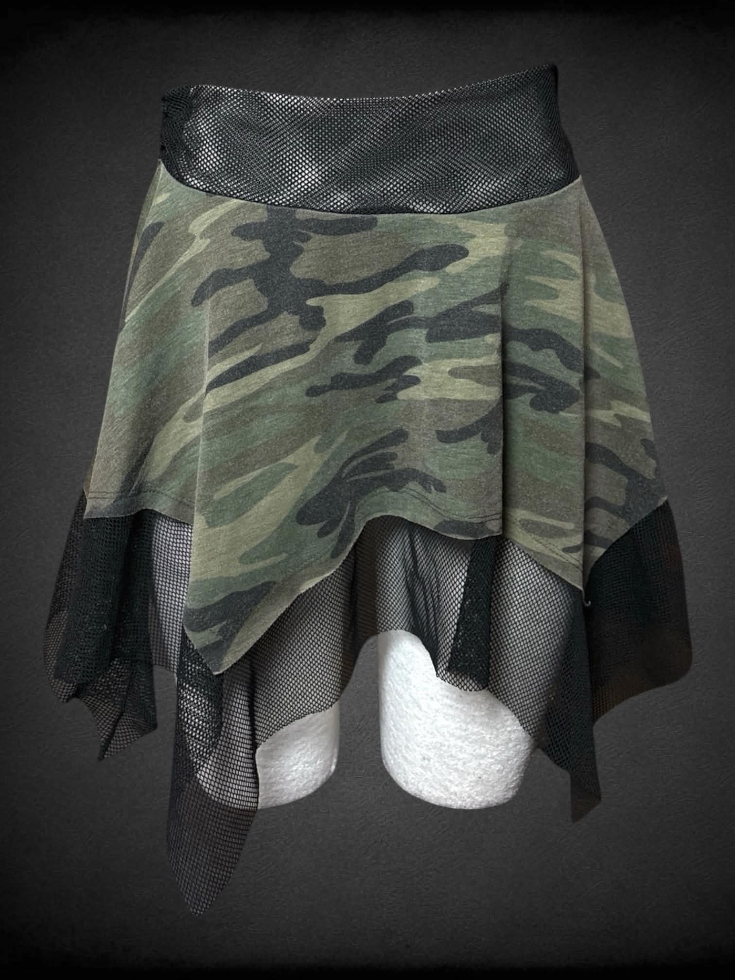 L Wet Seal camo skirt with black fishnet lining and waist