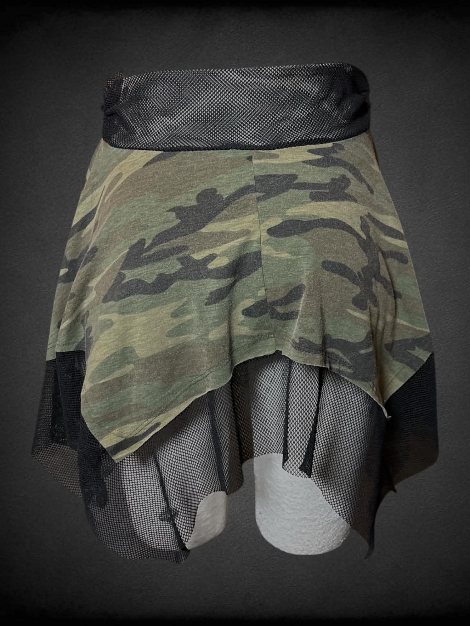 L Wet Seal camo skirt with black fishnet lining and waist
